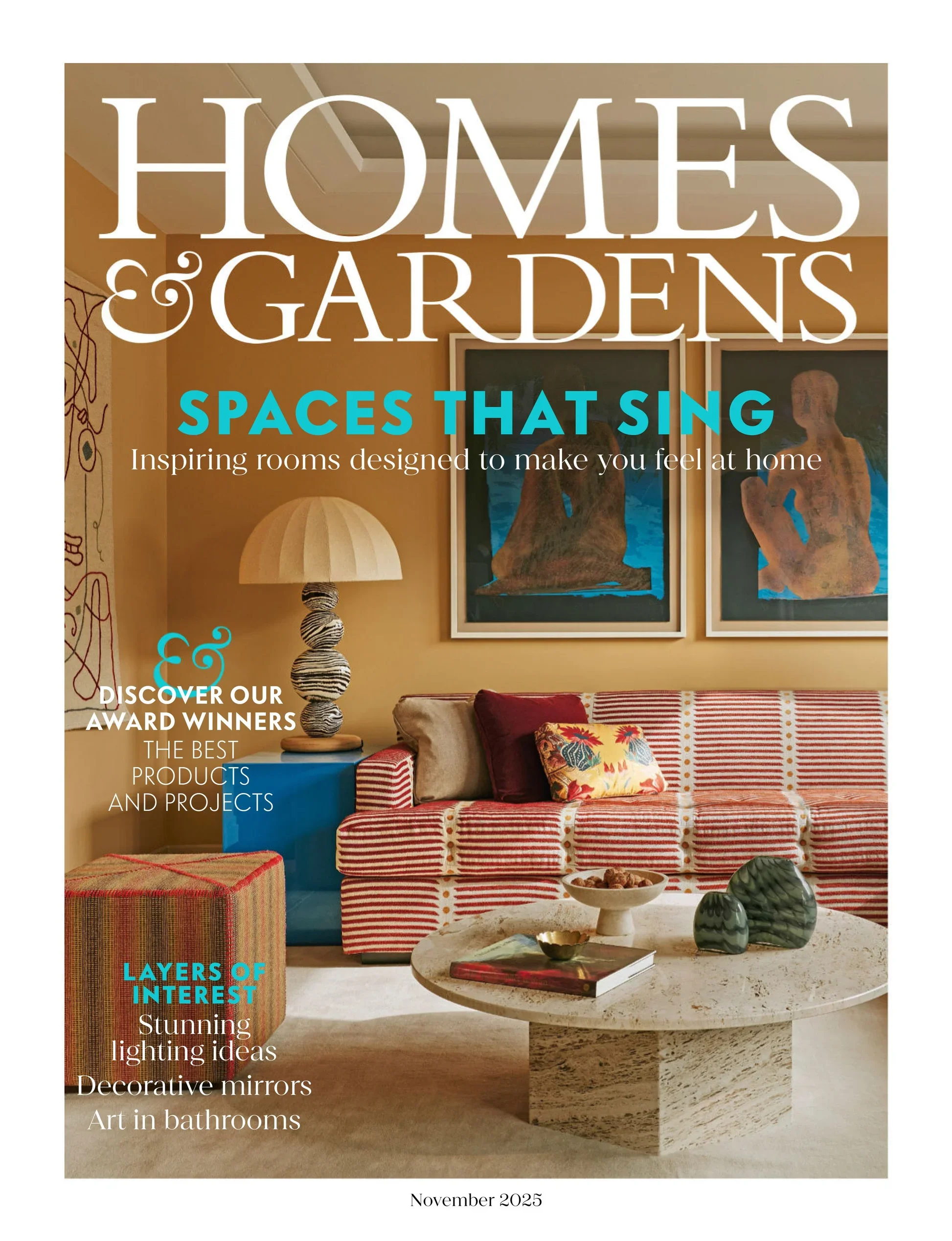 Cover of a magazine titled 'HOMES & GARDENS', featuring a stylish living room with art on the wall, a lamp, a blue side table, a sectional sofa with patterned and solid throw pillows, and a coffee table with decorative objects. Subheadings include 'SPACES THAT SING', 'LAYERS OF INTEREST', and 'DISCOVER OUR AWARD WINNERS'. The issue is from November 2025.