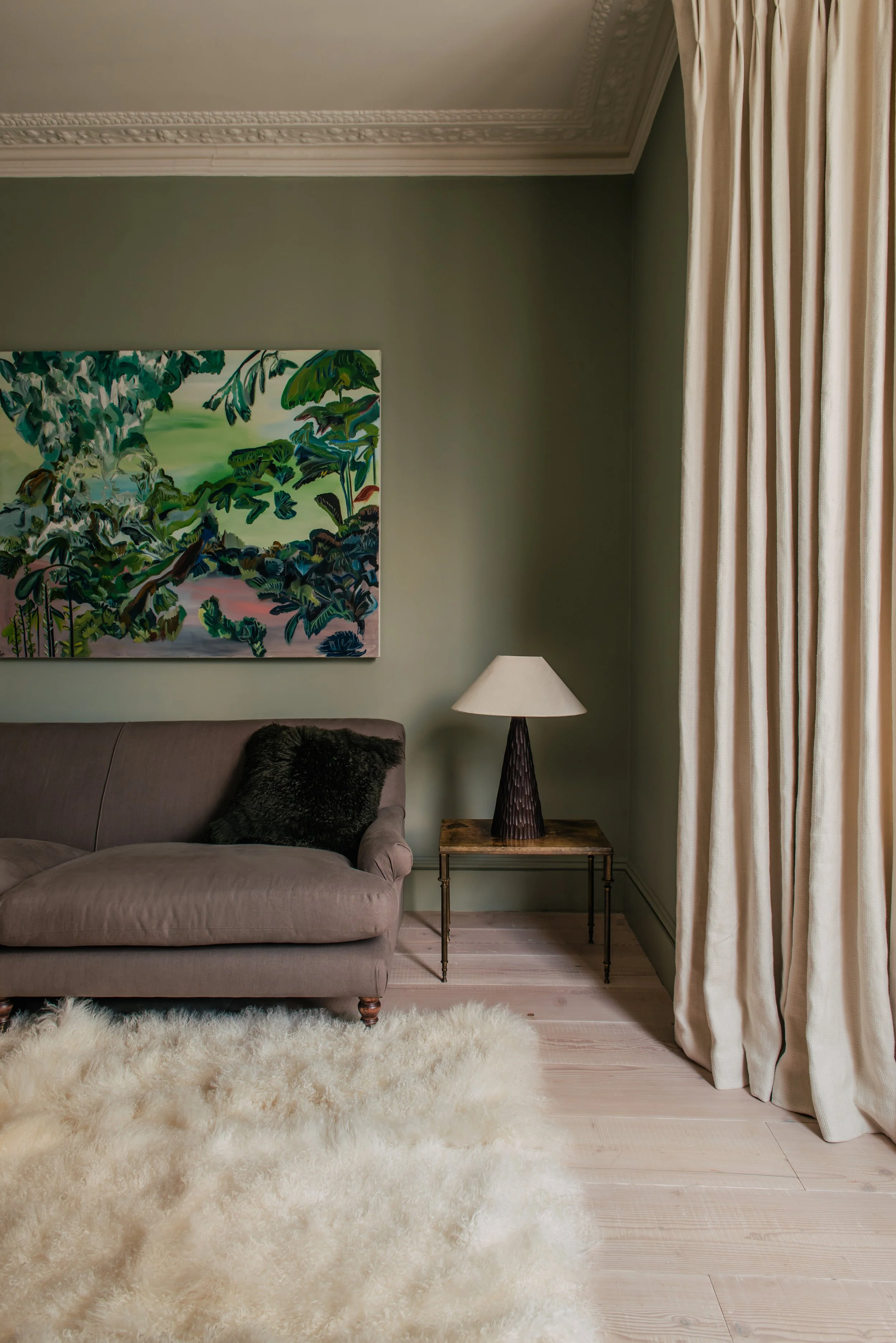 A green living room designed by George Jessel Designs