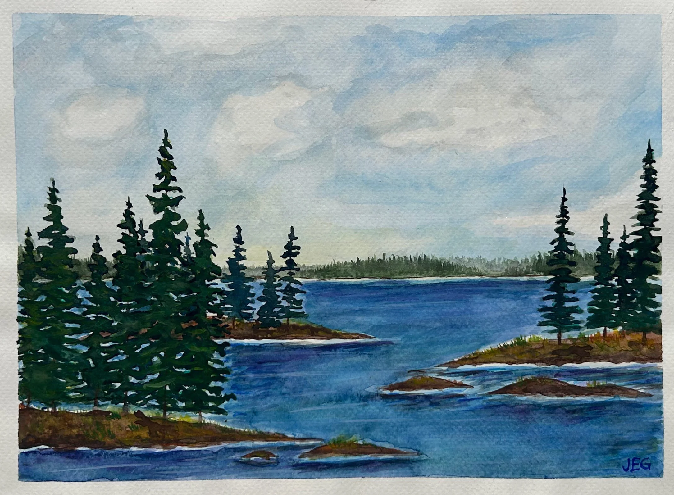 Watercolor painting of a lake with green pine trees in the foreground, distant land on the horizon, blue sky with clouds, and a signature in the bottom right corner.