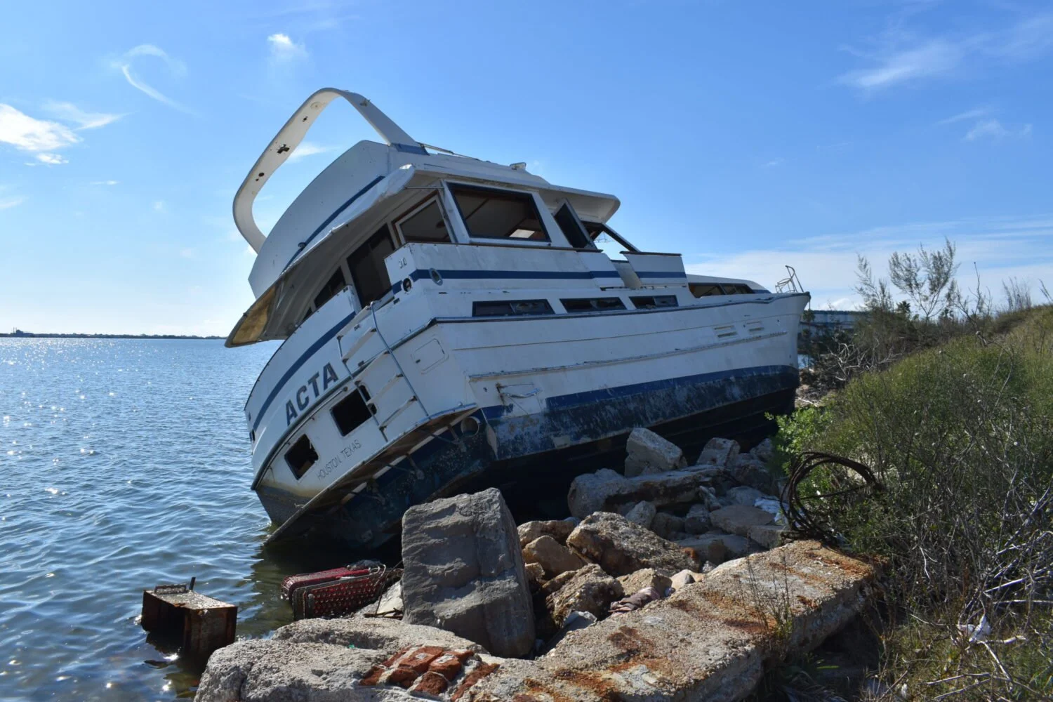 Below a Calm Lake, a Fleet of Boats Leaking Fuel