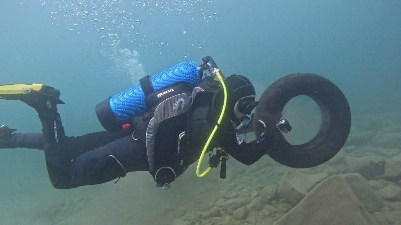 Divers Found the Tires. A Boat Crew Hauled Them Out.