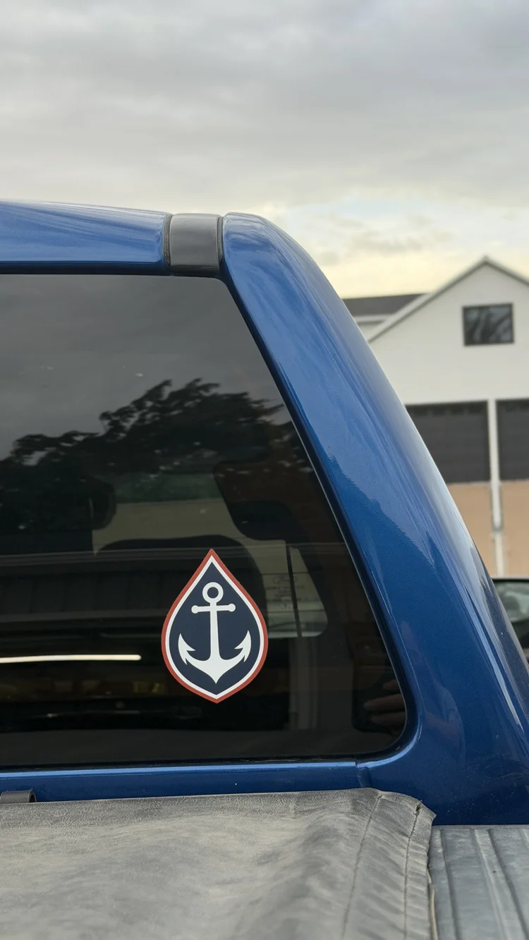 Fathom Restoration die-cut anchor logo sticker on a truck rear window