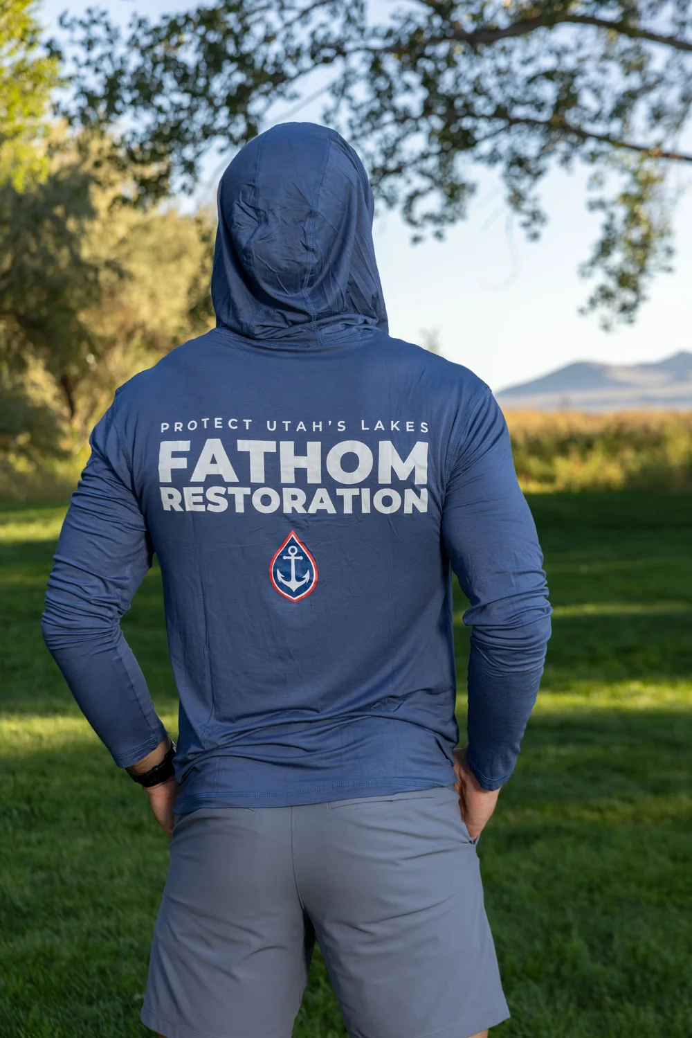 The hooded shirt with the hood up, from behind, at Utah Lake