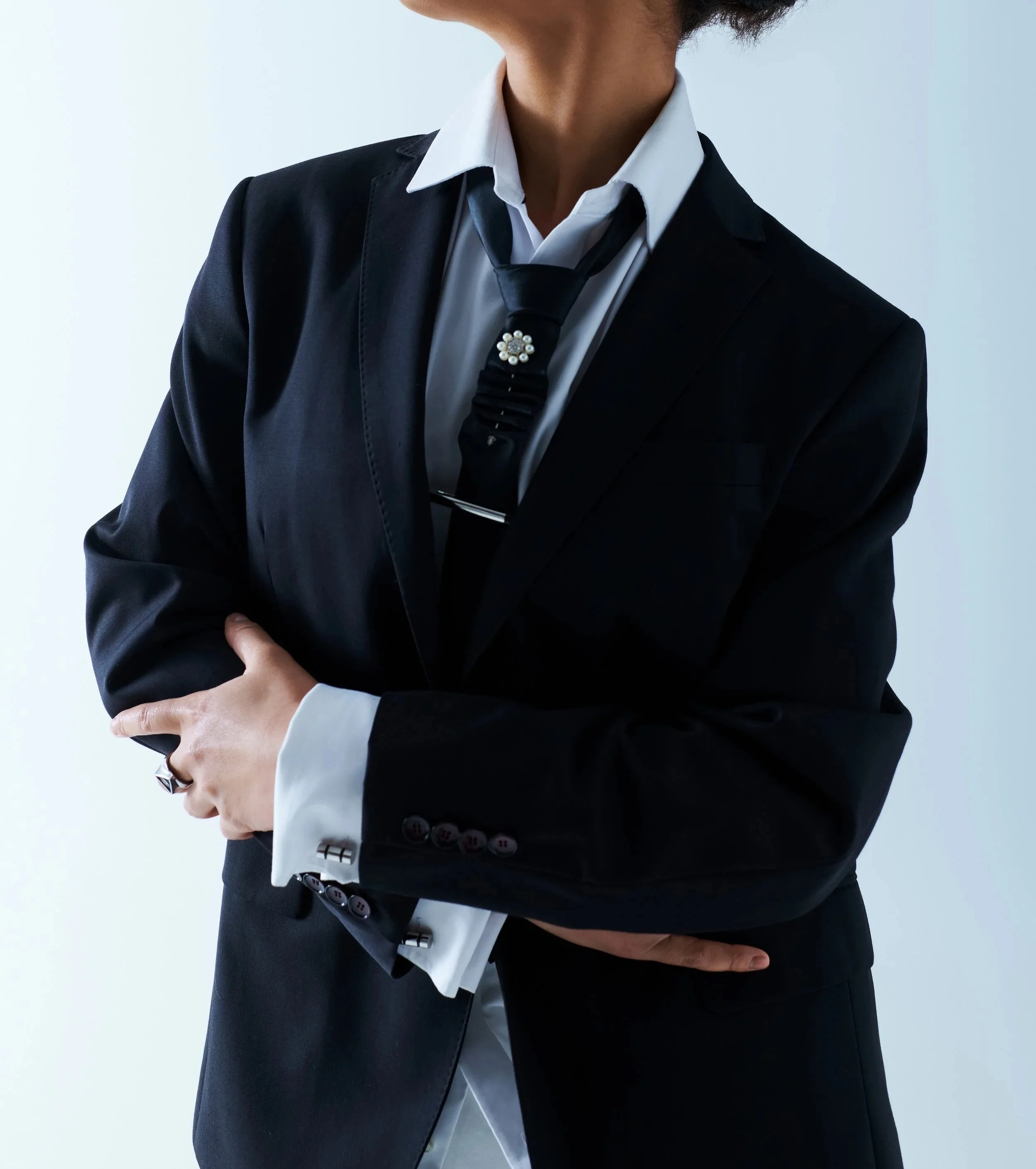 woman-in-black-suit-with-decorative-tie-2026-01-06-00-08-14-utc.jpg