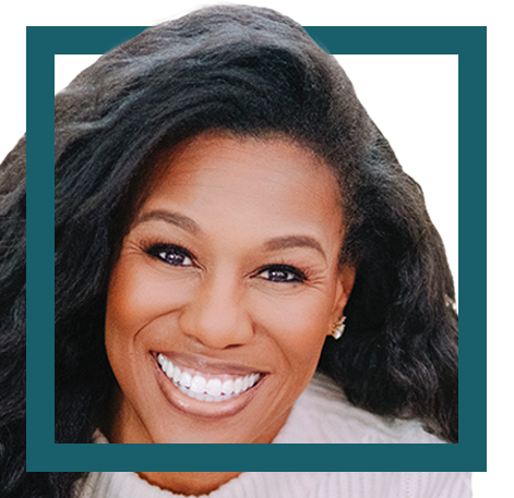 Close-up of a smiling Black woman with long, wavy hair, wearing earrings.