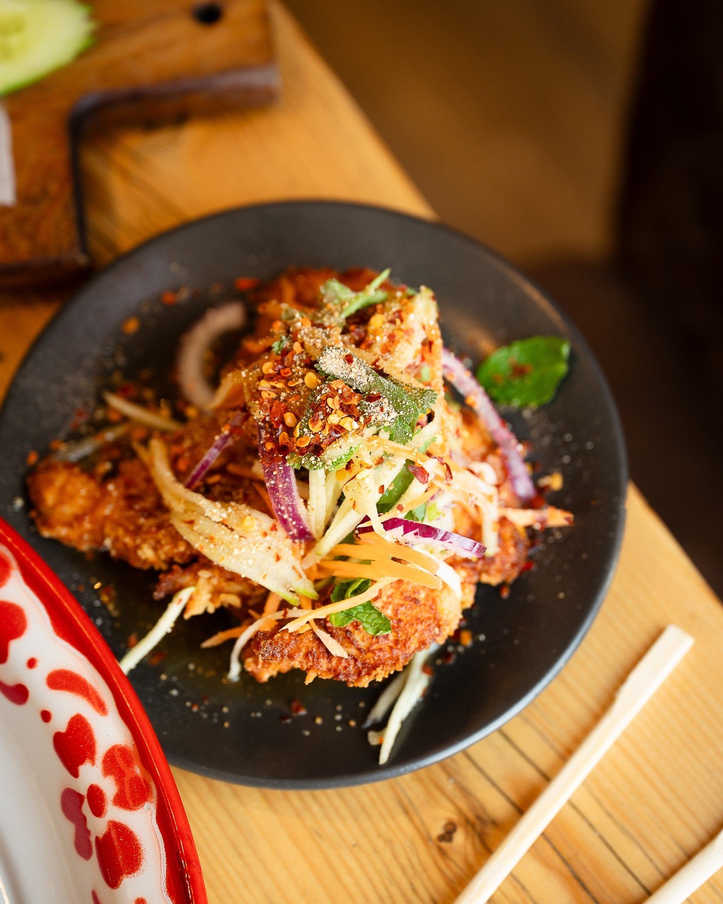 Our delicious Yam Gai Tord is calling you 📱 

👀 Available as a main and as part of our set Thai Tapas. 😋 

 🍗 Crispy Thai fried chicken layered in a vibrant spicy salad with fresh herbs, red onion and this one is chilli&mdash;bold, zesty, and ful