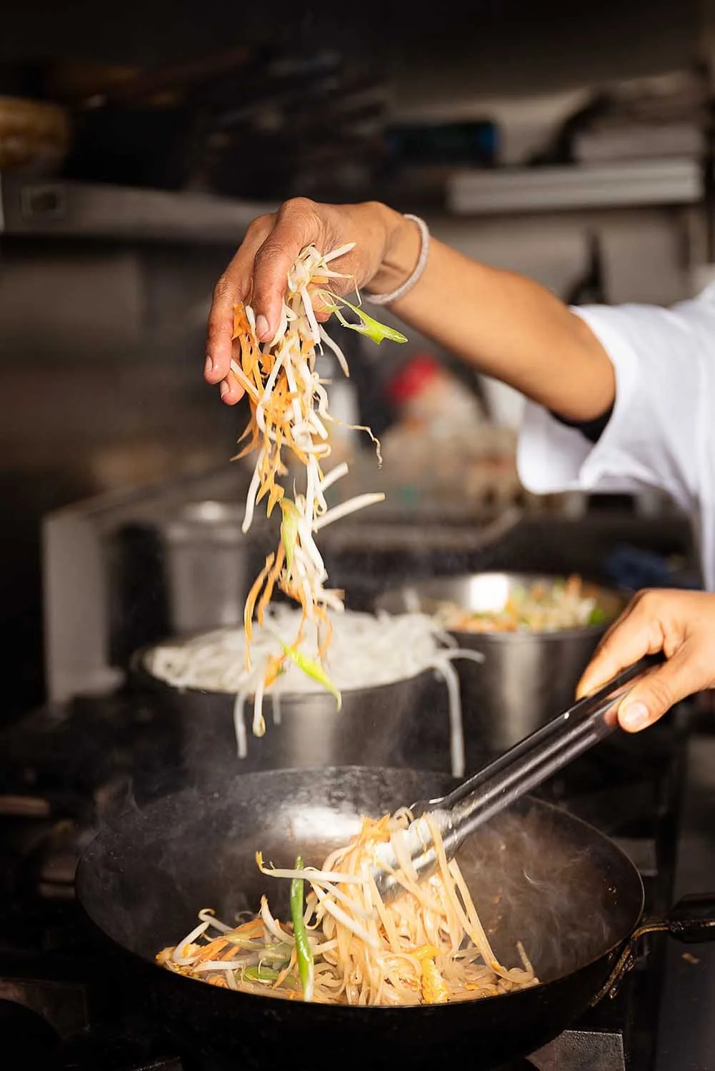 Fresh Thai Cooking at The Tiny Thai - bean sprouts being added to frying pan for stir fry