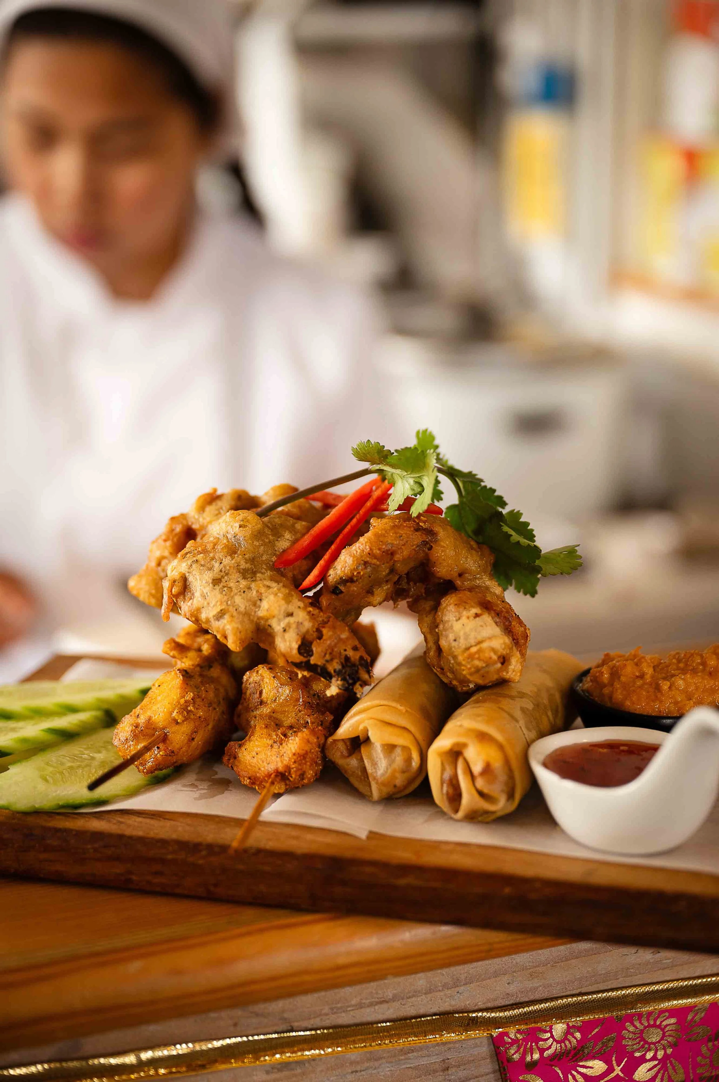 Mixed Starters at the Tiny Thai, Chef Jom cooking in the background