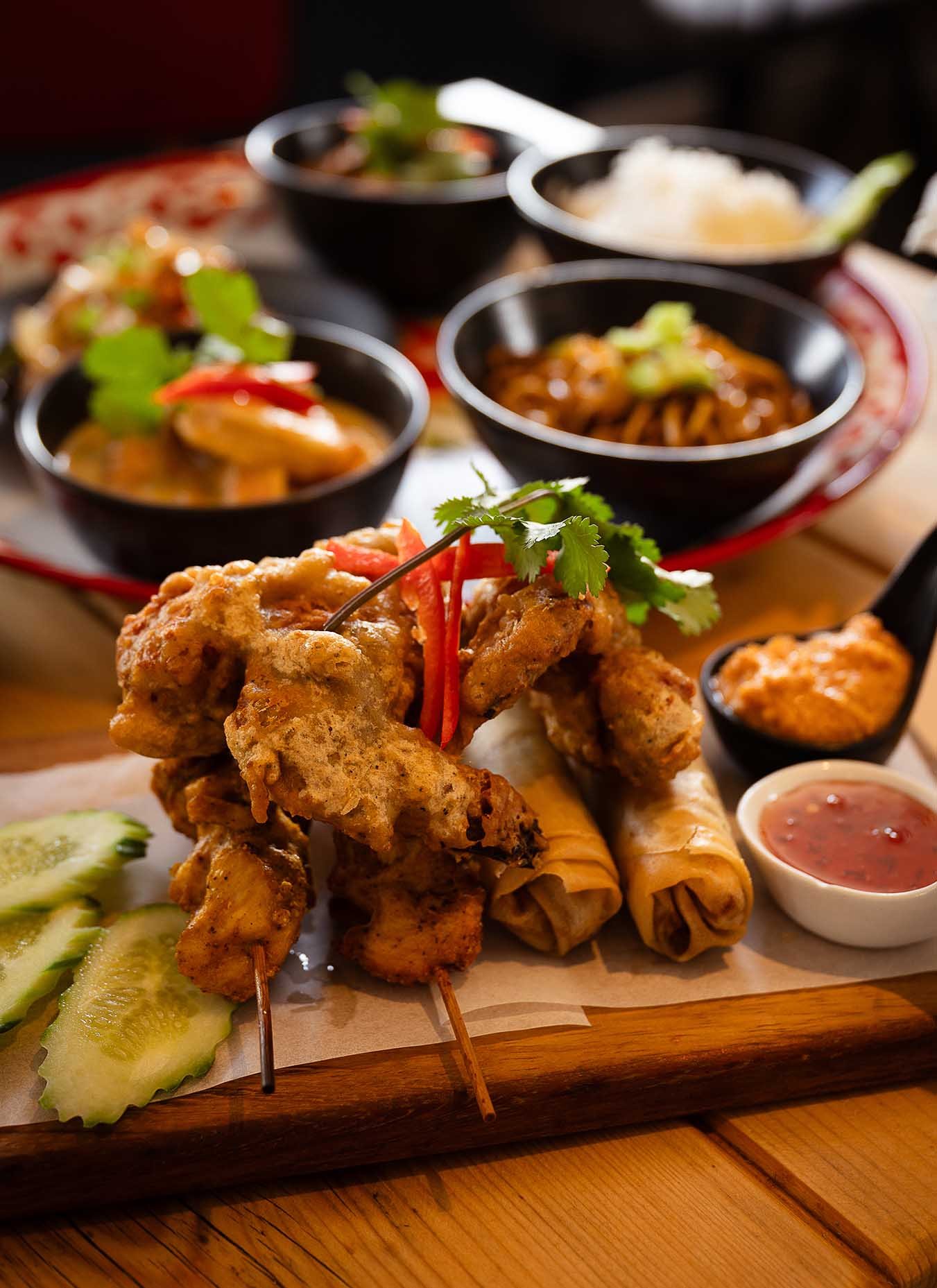 Thai Banquet with satay chicken, Spring Rolls, Chicken Wings and Thai curries.  Cornwall