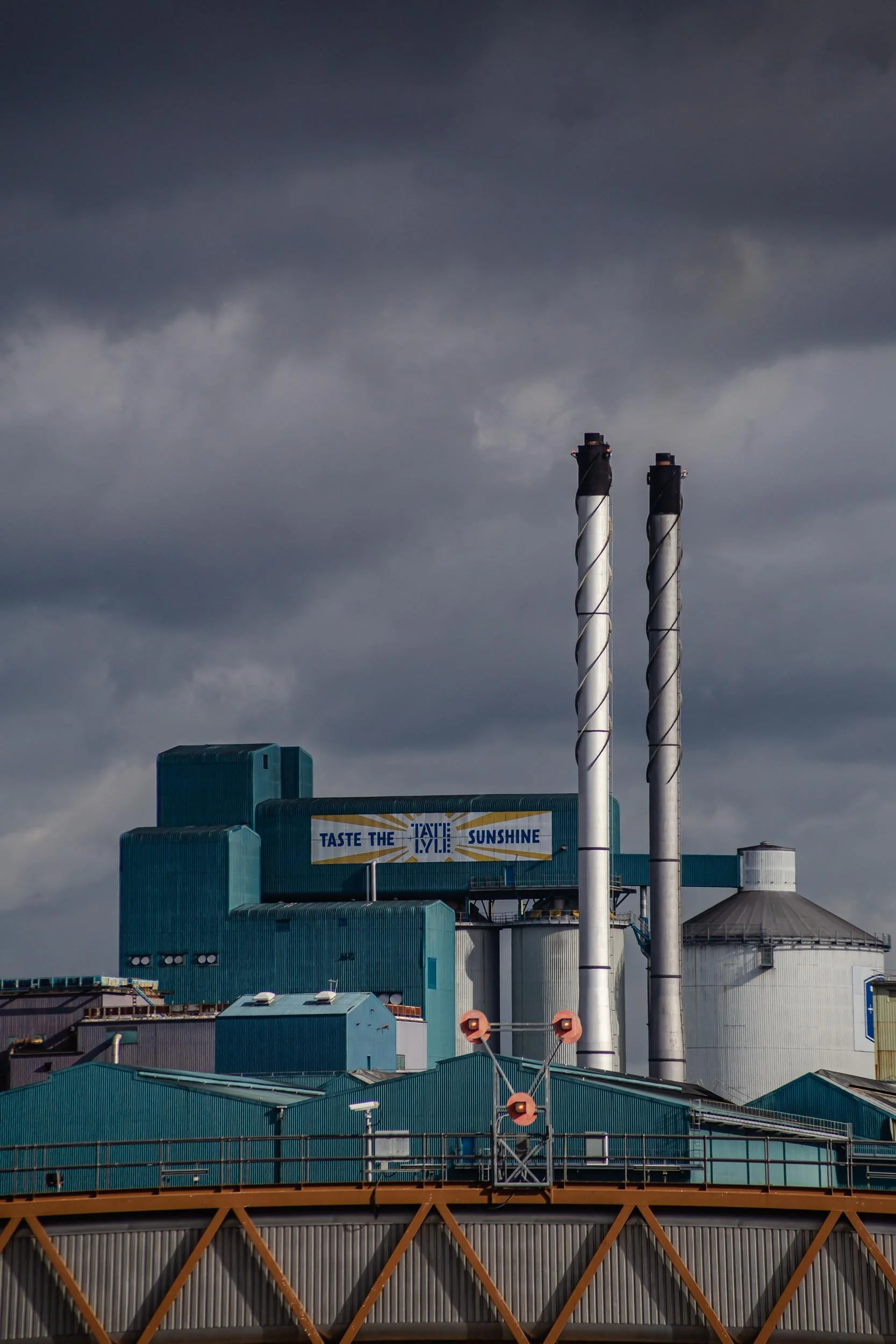 Moody skies over Tate & Lyle Sugar Factory in East London, Royal Docks, E16. Taste the sunshine.