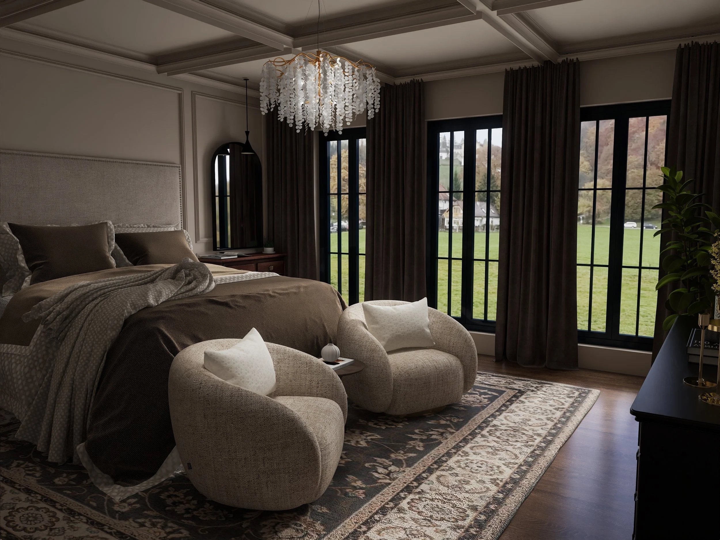 A bedroom with beige bedding, a large headboard, and beige armchairs arranged around a patterned rug, with large windows covered by dark curtains and a view of a green yard and houses outside.