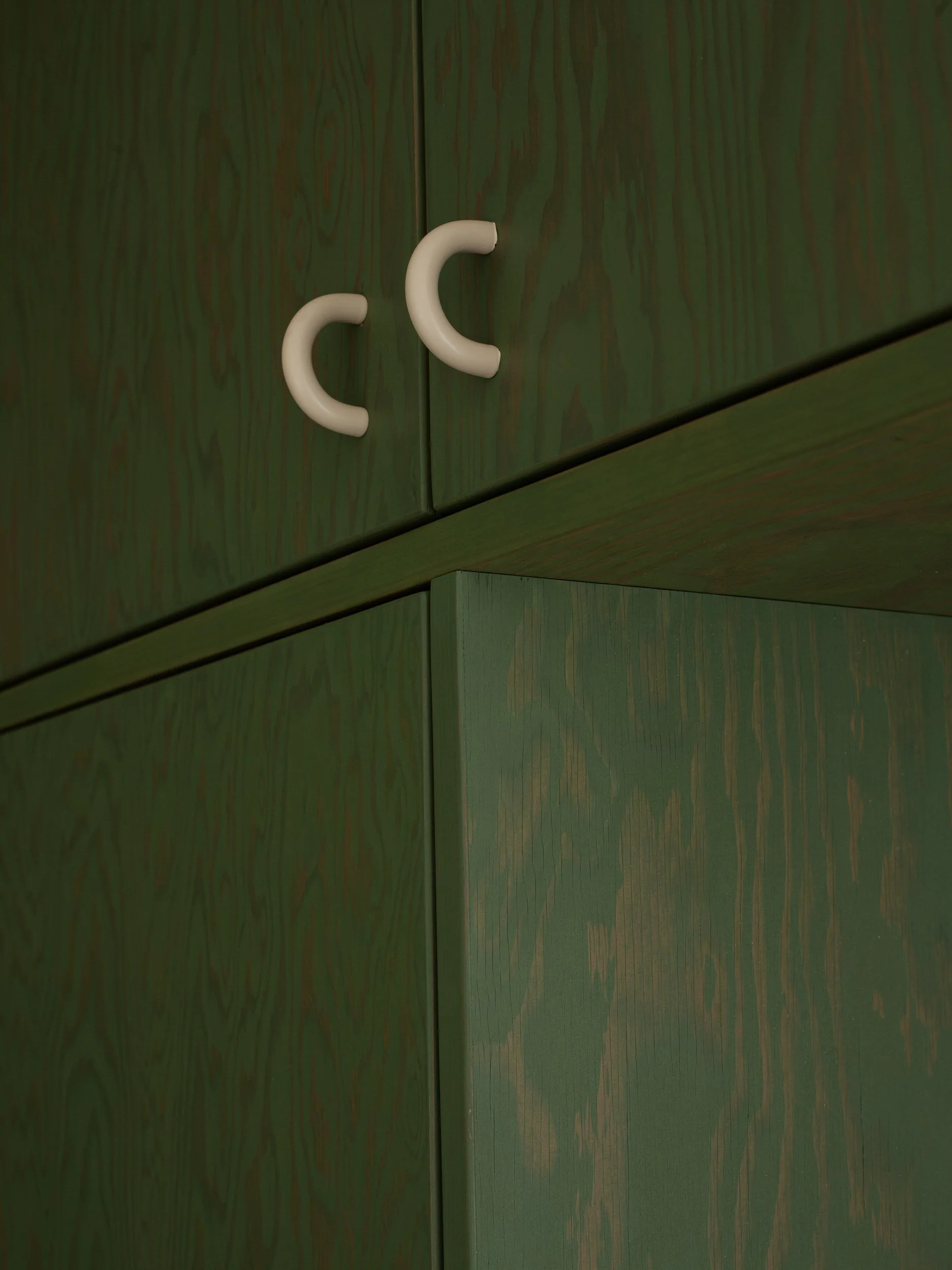 Bespoke powder coated handles on a Verona Green Linolie oiled Douglas Fir ply wardrobe.