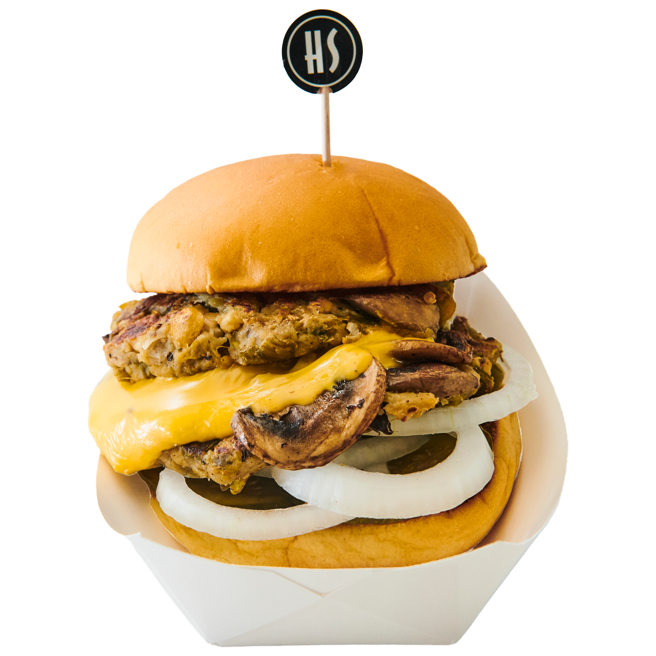 Close-up of a burger with a soft bun, sausage patty, melted cheese, sautéed mushrooms, and sliced onions, served on a white plate.