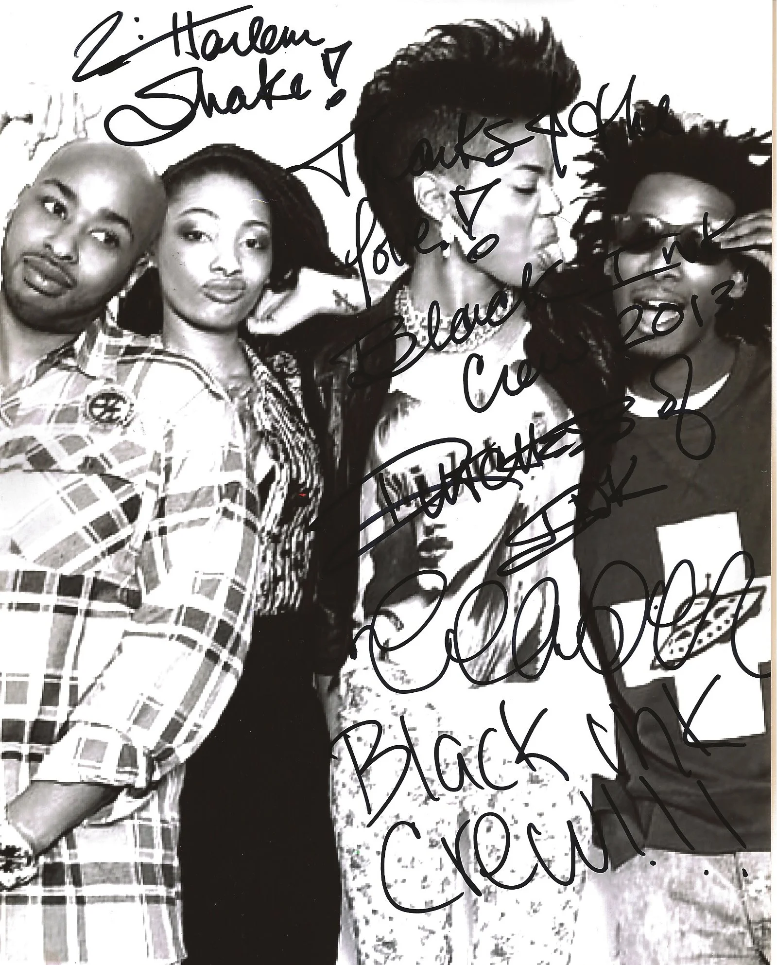 Black and white photo of four women, two with short hair, one with long braids, and one with curly hair, standing together, with handwritten notes overlaying the image.