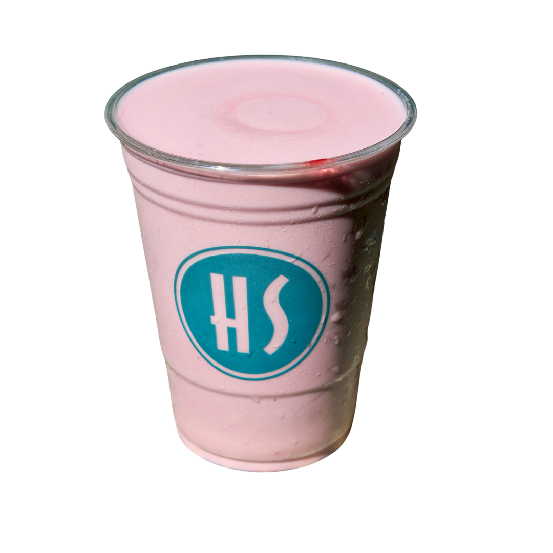 A pink milkshake in a clear plastic cup with a blue and white logo, against a black background.