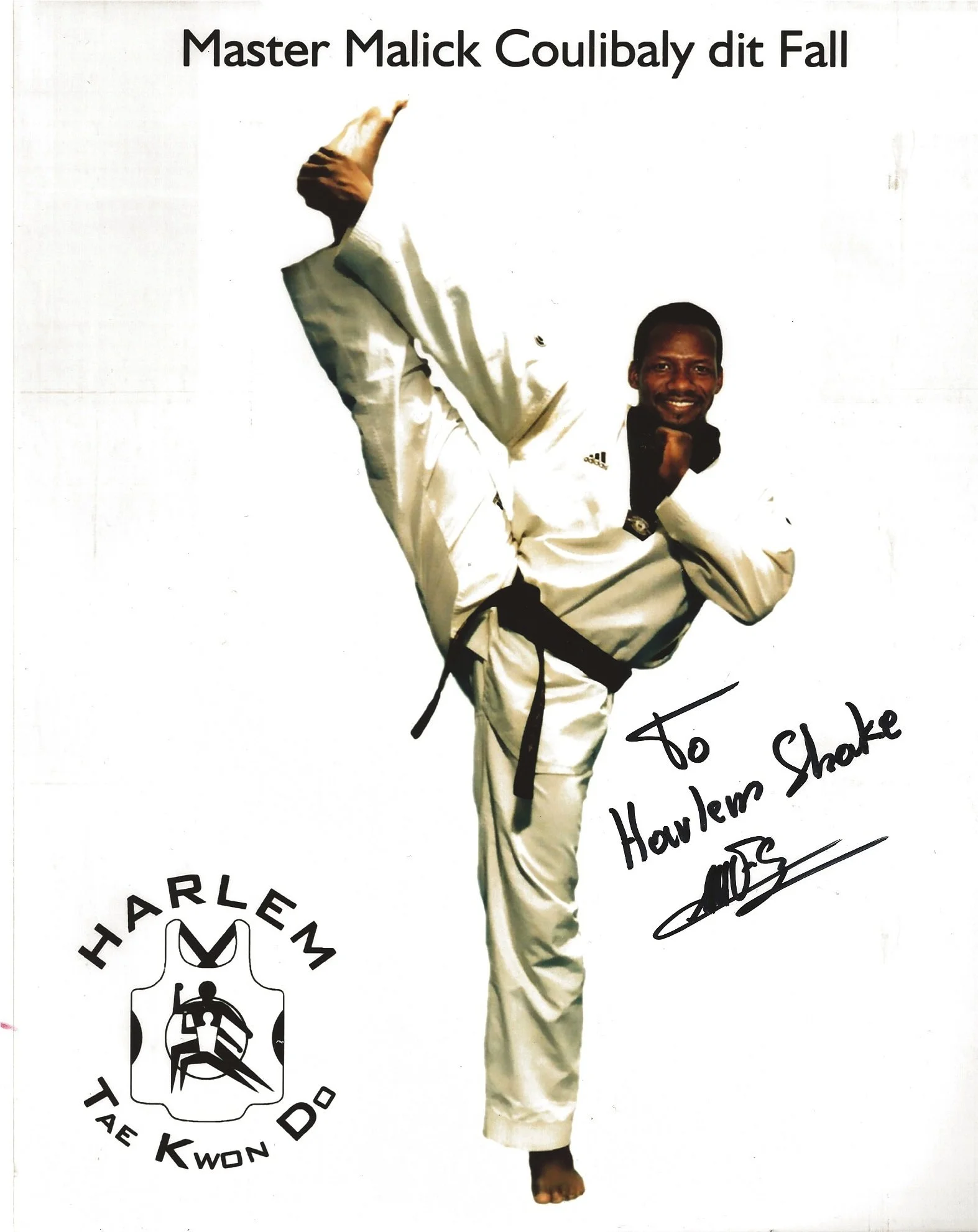Photo of a man in a white martial arts uniform with a black belt, performing a high kick. There is handwritten text saying 'To Shake, Harlem from' and a signature. The logo of Harlem Taekwondo is visible on the bottom left.