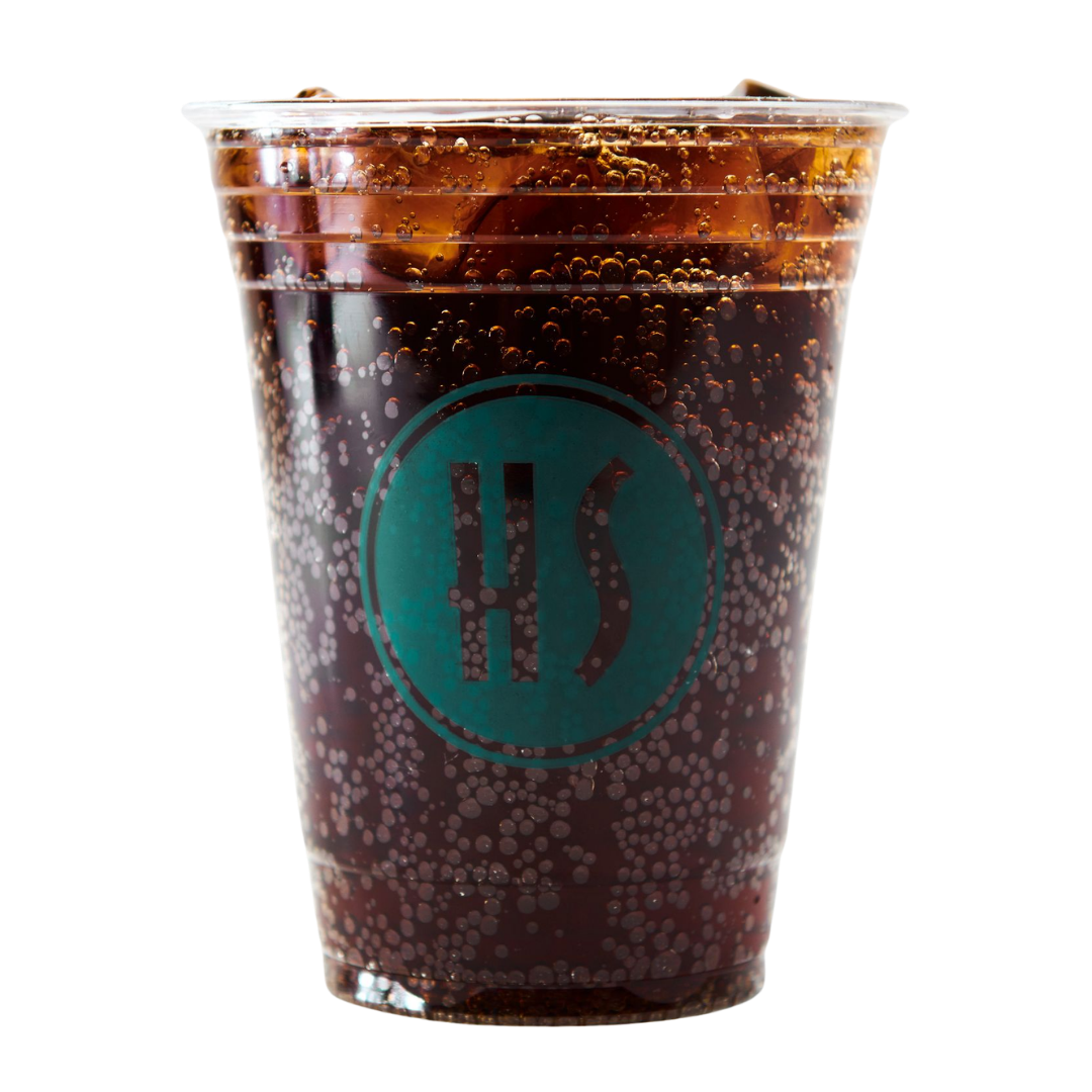 A clear plastic cup filled with dark soda and ice, featuring a teal logo with 'HS' on the front.