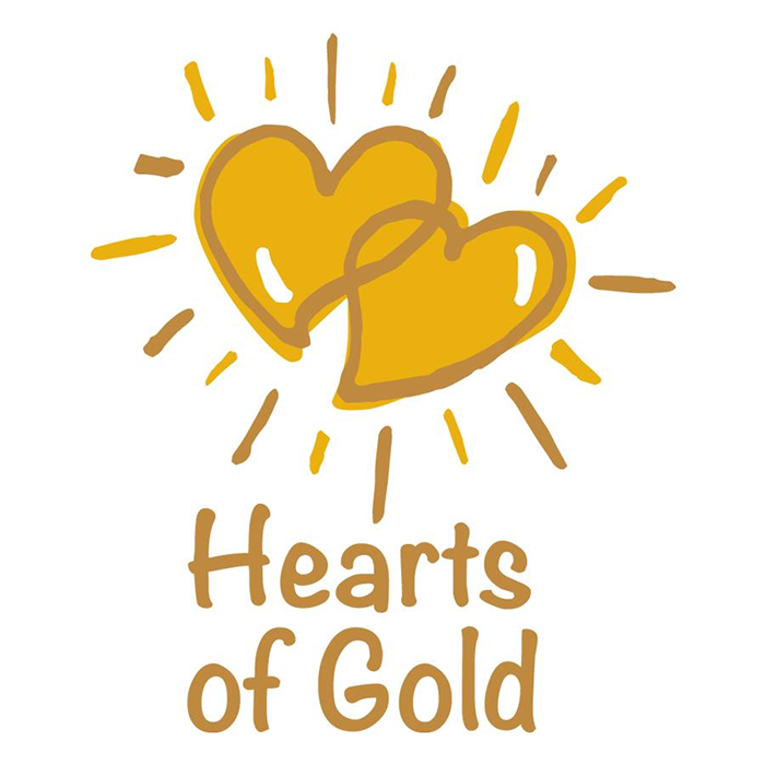 Two gold hearts with a connecting ribbon, surrounded by radiating lines, with the words 'Hearts of Gold' written below.