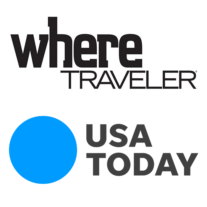 Logo for 'Where Traveler' with the words in bold black font and a smaller 'Traveler' underneath, alongside a blue circle and the words 'USA Today' in bold black font.