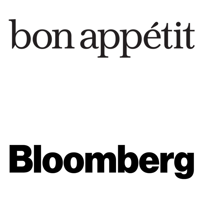 The words 'bon appétit' in elegant black font at the top and 'Bloomberg' in bold black font at the bottom on a white background.