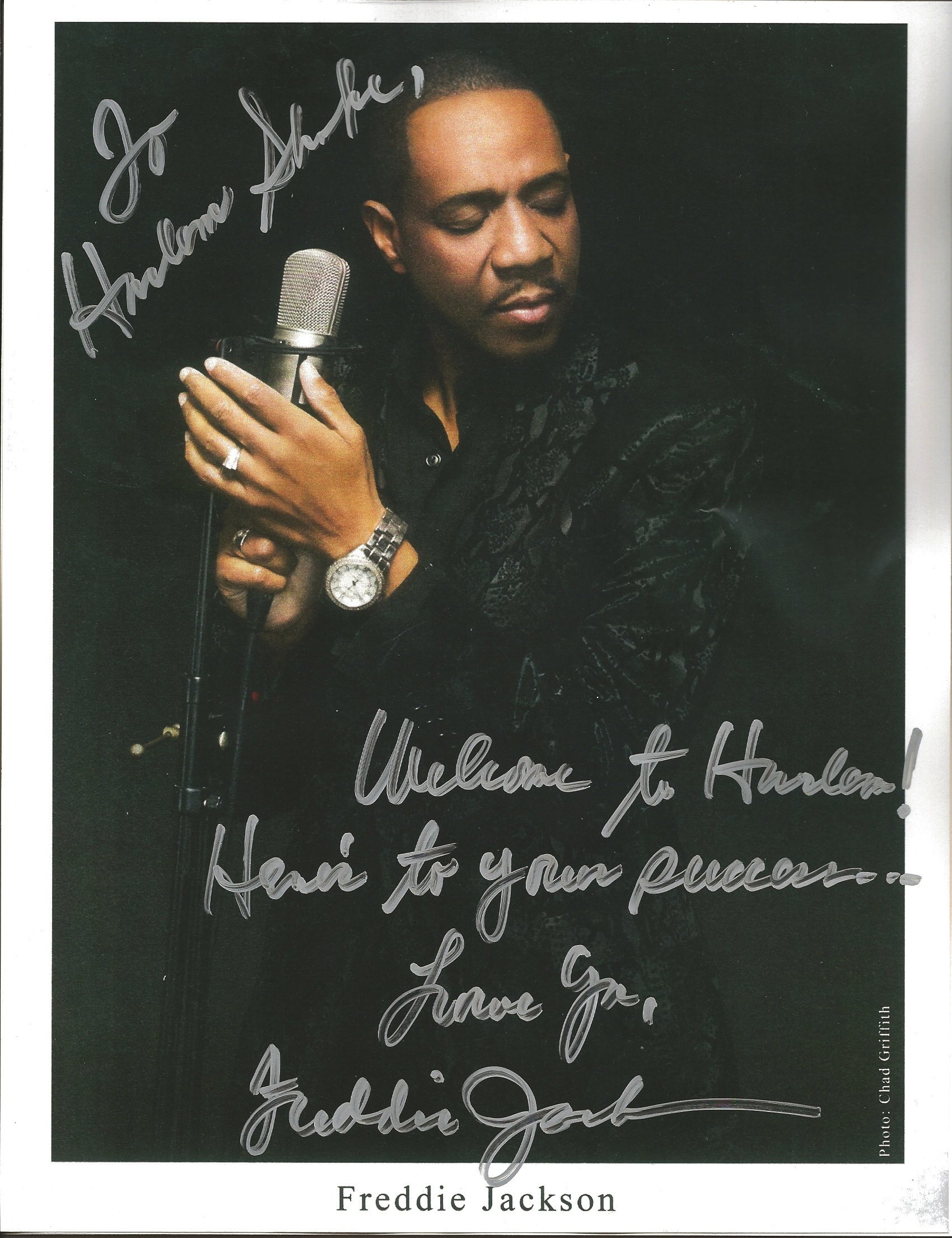 Autographed photo of Freddie Jackson with a microphone, featuring the message "To Sharle, Welcome to Kentucky!" and signed by Freddie Jackson, with his name printed below.
