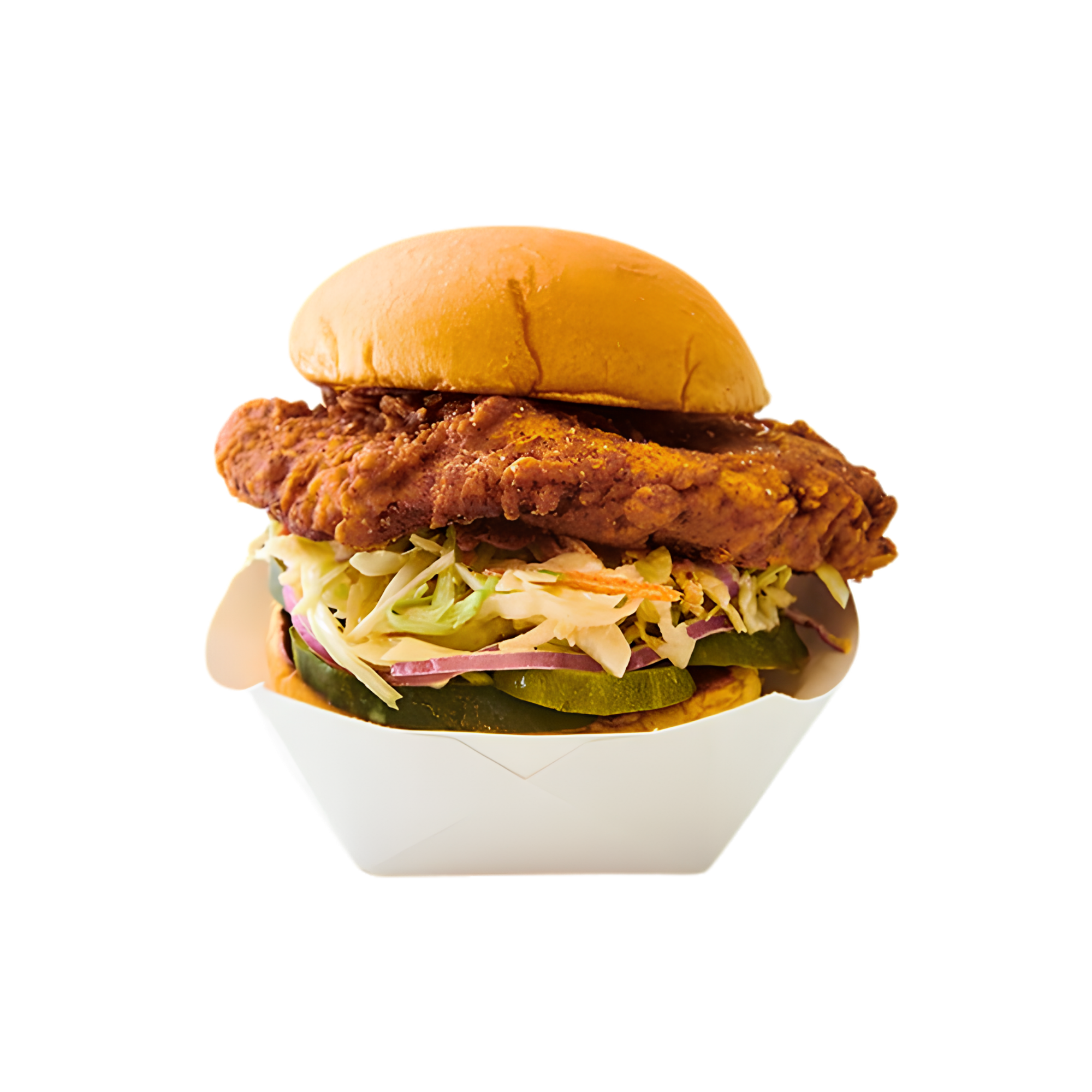 Close-up of a fried chicken sandwich with lettuce, pickles, and sauce inside a bun.