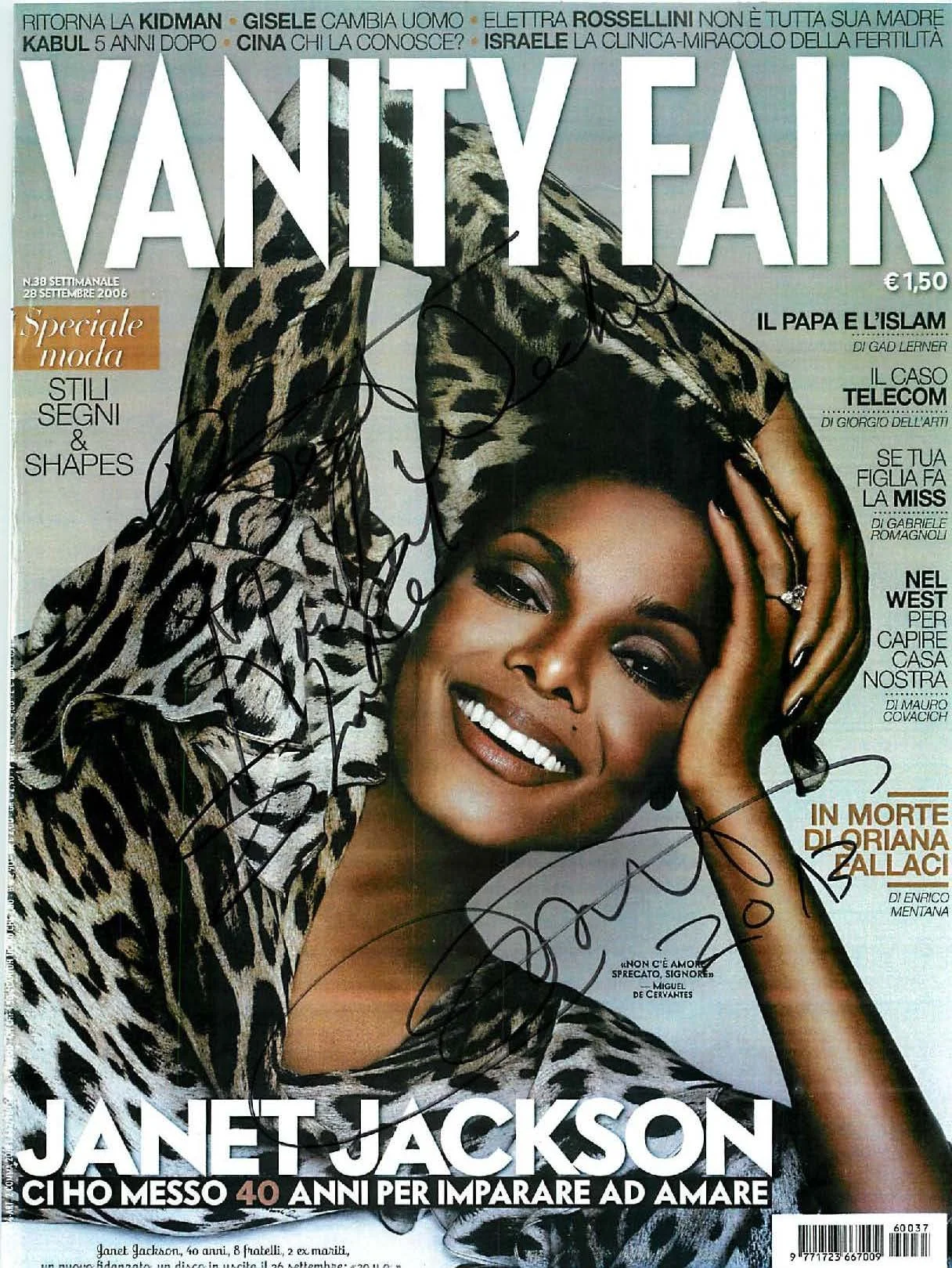 Cover of Vanity Fair magazine featuring Janet Jackson smiling with a leopard print outfit and a head covering, with signatures and text in Italian.