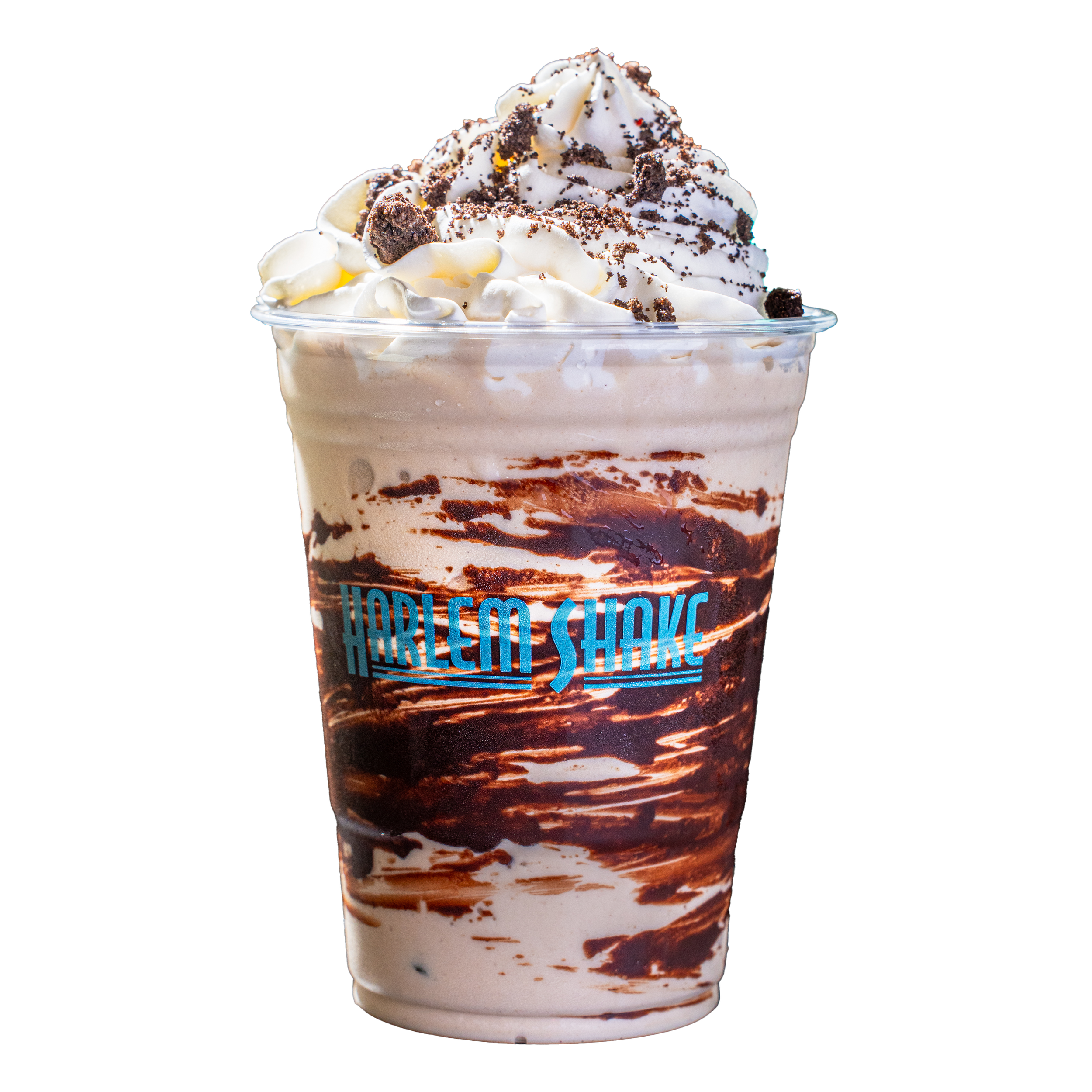 A close-up of a whipped cream dessert topped with crushed chocolate cookies and chocolate syrup in a clear plastic cup.