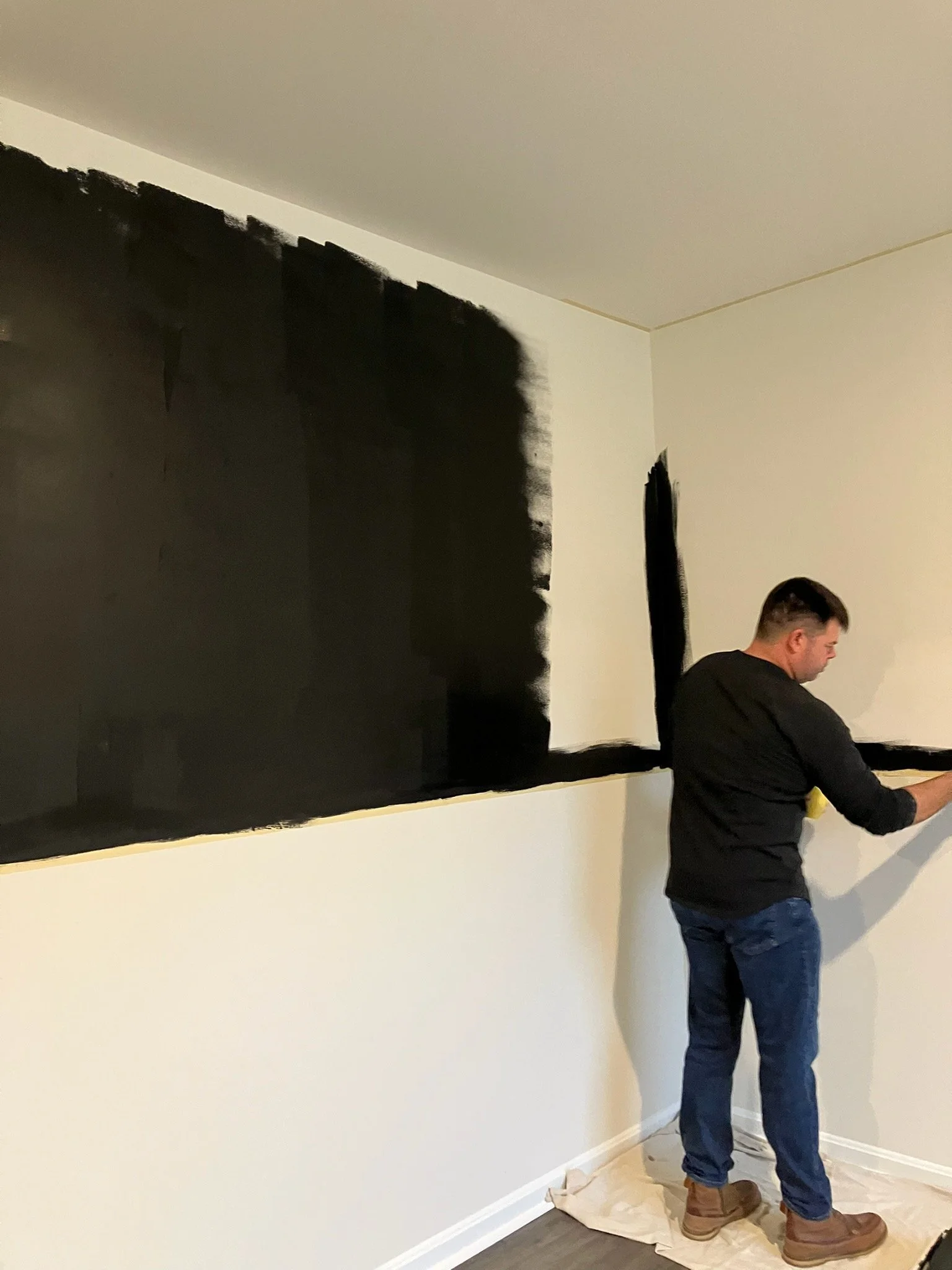 Austin Hunt of Coastal Property Services turning a flex room into a home office with wainscoting, paint, and wallpaper.