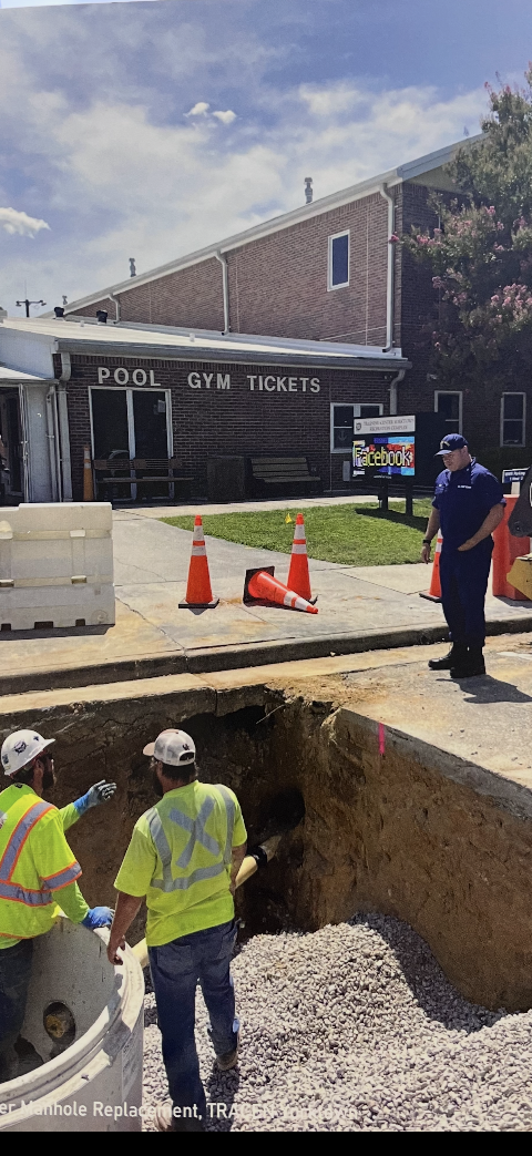 Austin Hunt of Coast Property Services working with subcontractors on infrastructure replacement project.