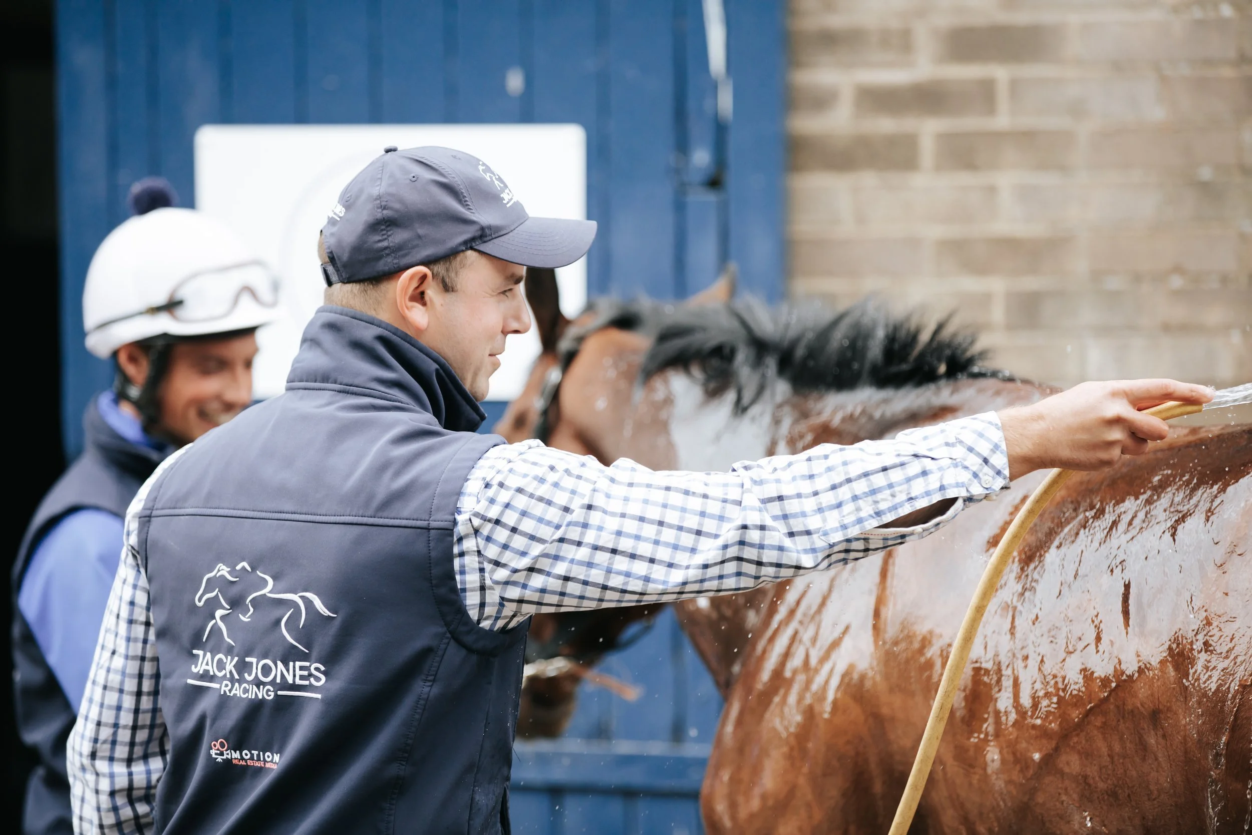 jack-jones-racing-stable-team-patting-racehorse-104.jpg