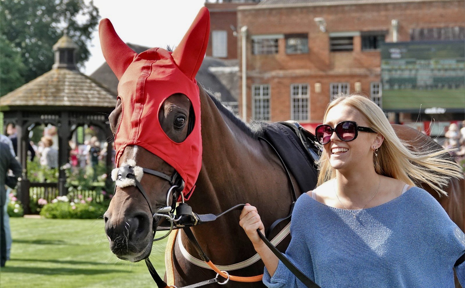 jack-jones-racing-racehorse-in-red-hood-with-handler-111.jpg