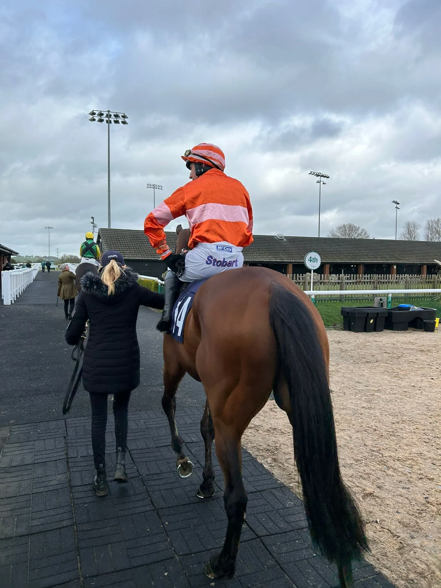 jack-jones-racing-racehorse-and-orange-silk-jockey-in-paddock-105.jpeg