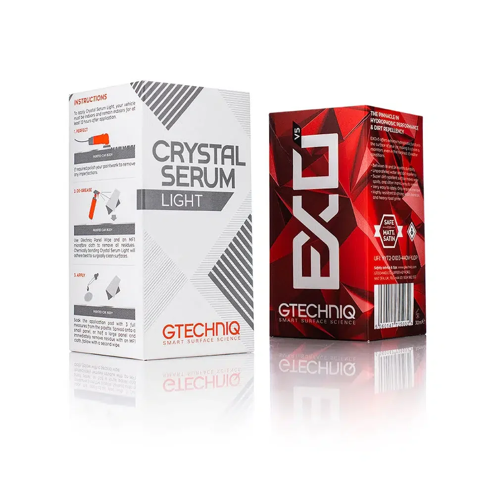 Two boxes of skincare products, one labeled 'Crystal Serum Light' in white and gray packaging, the other labeled 'DARK' in red and black packaging.