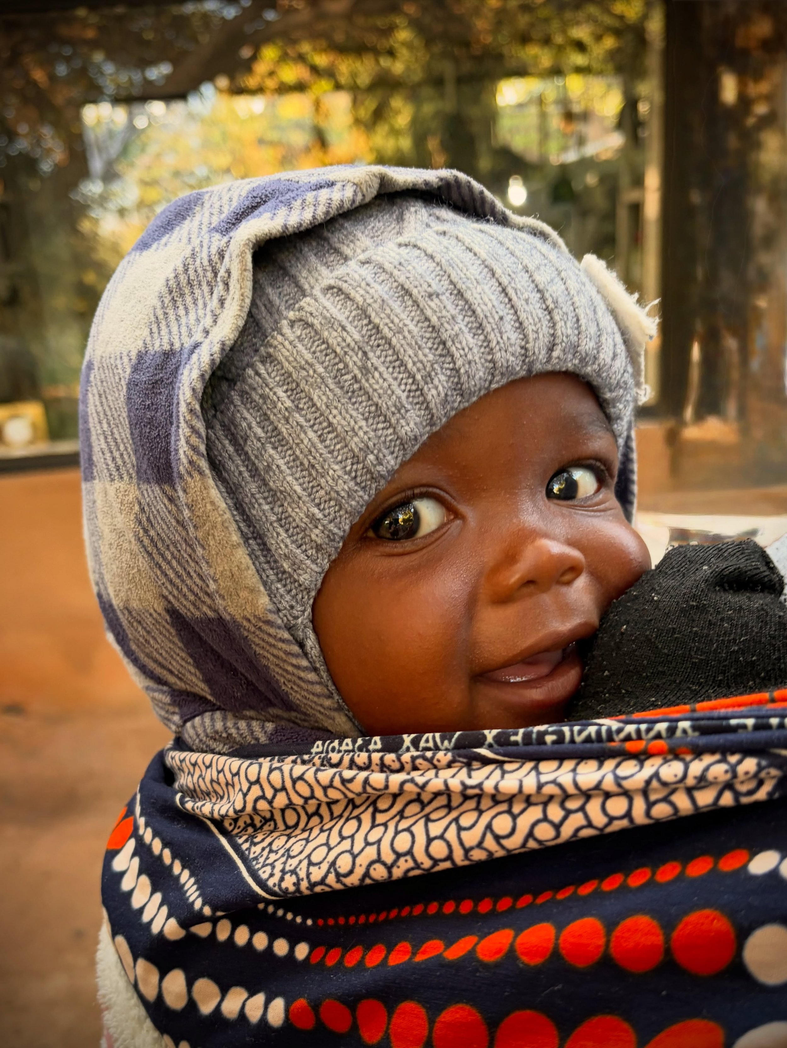 Meet John Samwaka, the youngest member of our SavannaBel team! 😍 John arrives every morning with his mum, Catherine, to help process the pecan nuts in our kitchen. #gratitude🙏 

#savannabelbushgourmet 
#pecannuts
#zambezivalley
