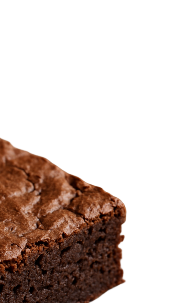 Close-up of a chocolate brownie cake slice with a cracked top surface.