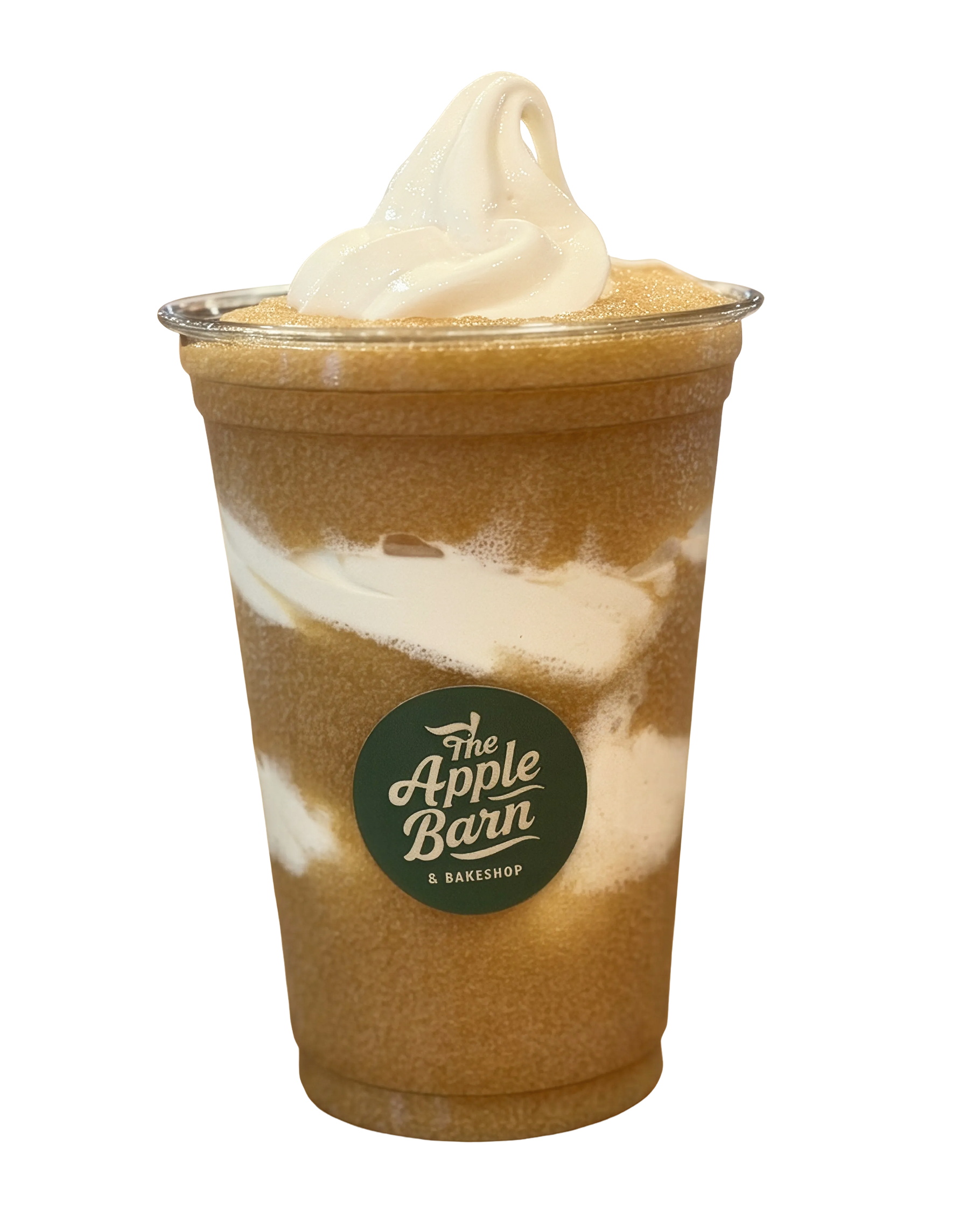 A plastic cup containing a caramel-colored iced beverage with whipped cream on top and a sprinkle of cinnamon or nutmeg. The cup has a dark green circular logo that reads 'The Apple Barn Bakeshop' and is set against a plain background.