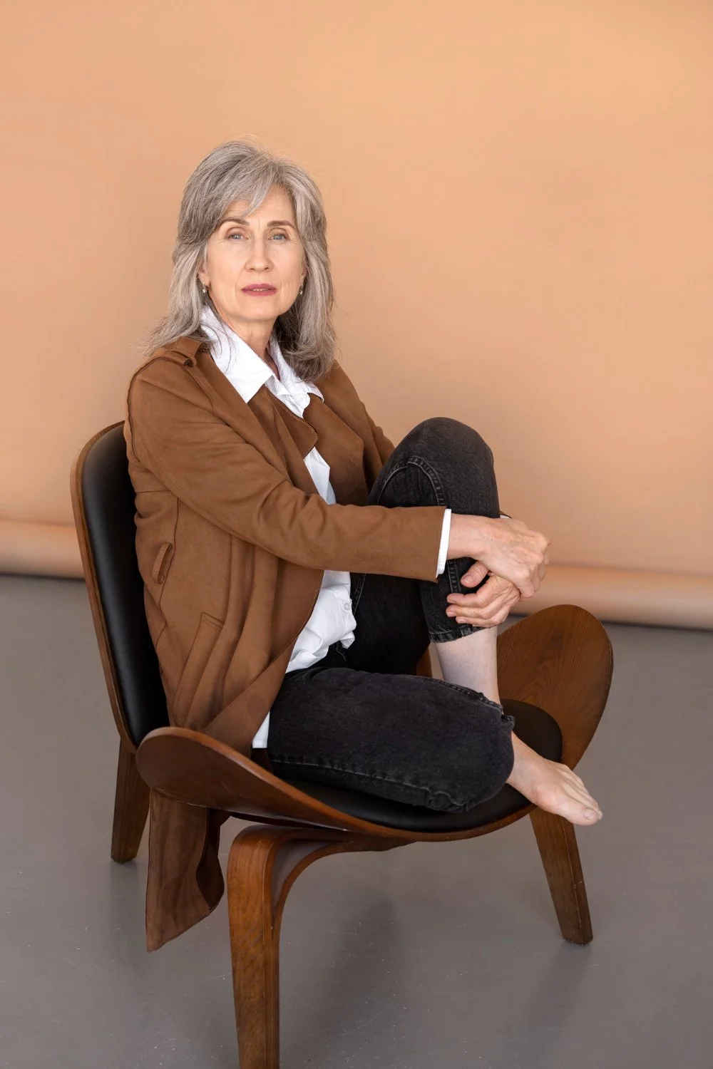 Woman sitting barefoot in a calm, grounded pose — representing body-aware, somatic therapy and EMDR treatment in Utah