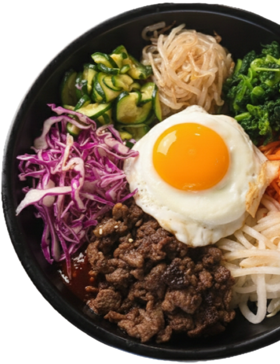 Bibimbap bowl with seasoned beef, fried egg, purple cabbage, cucumber, bean sprouts, spinach, and carrots over rice