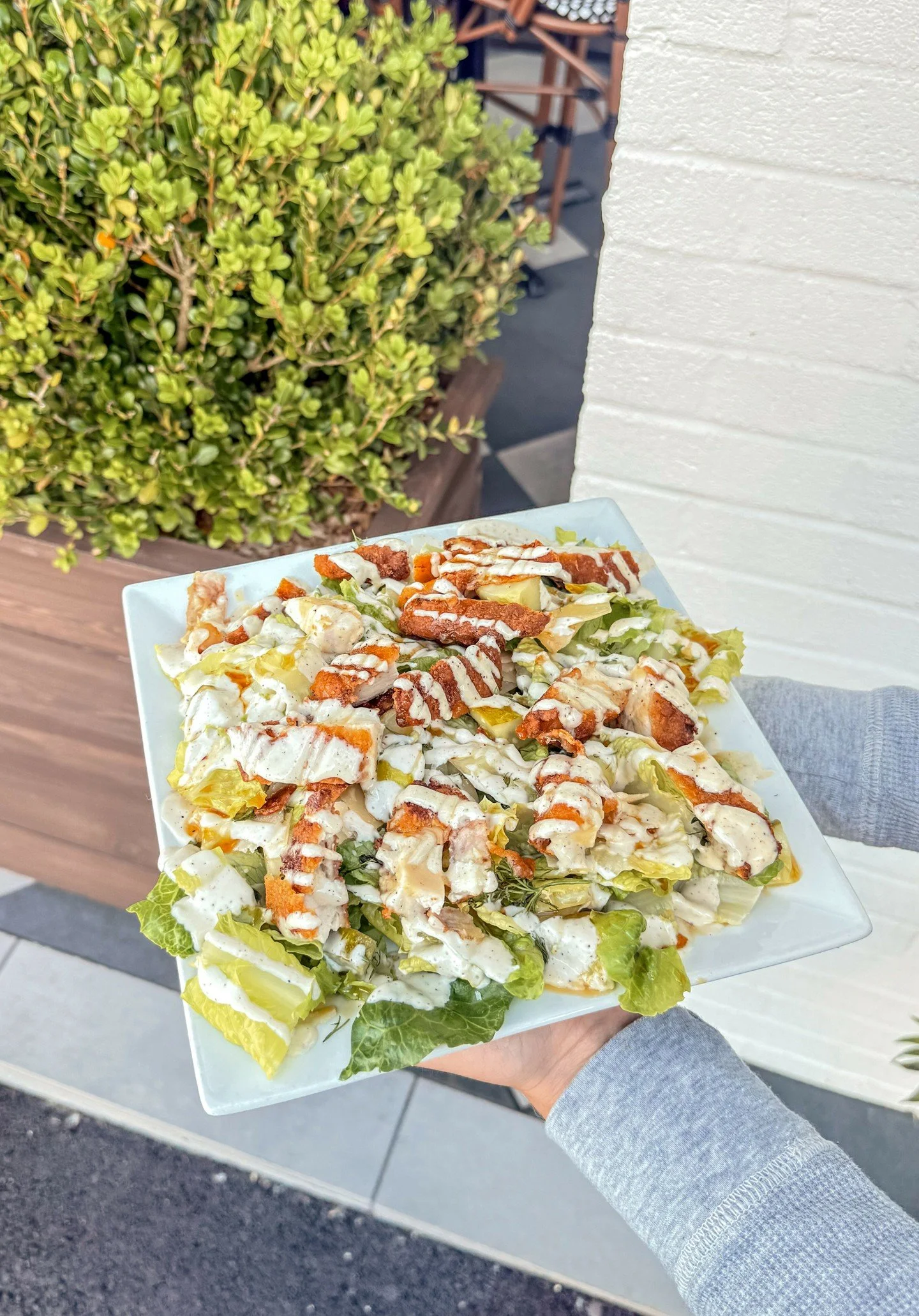 Meet your new go-to lunch! Our Crispy Chicken House Salad is one you won&rsquo;t want to miss 😋🥗

{Fresh romaine, crispy chicken, parmesan cheese, dill pickle, fresh dill, hot honey drizzle, and garlic aioli.}