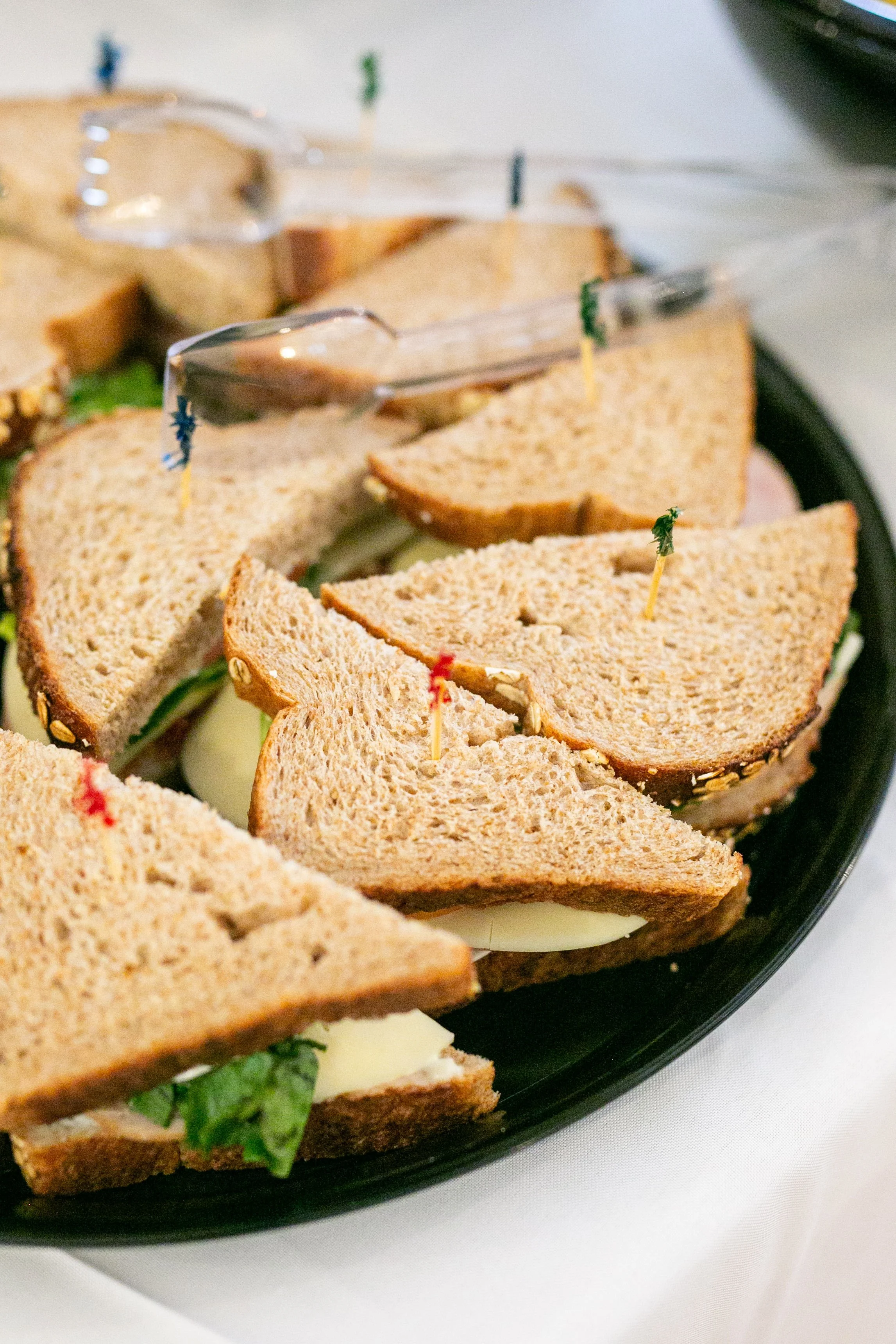 Close-up of assorted tea sandwiches tray.