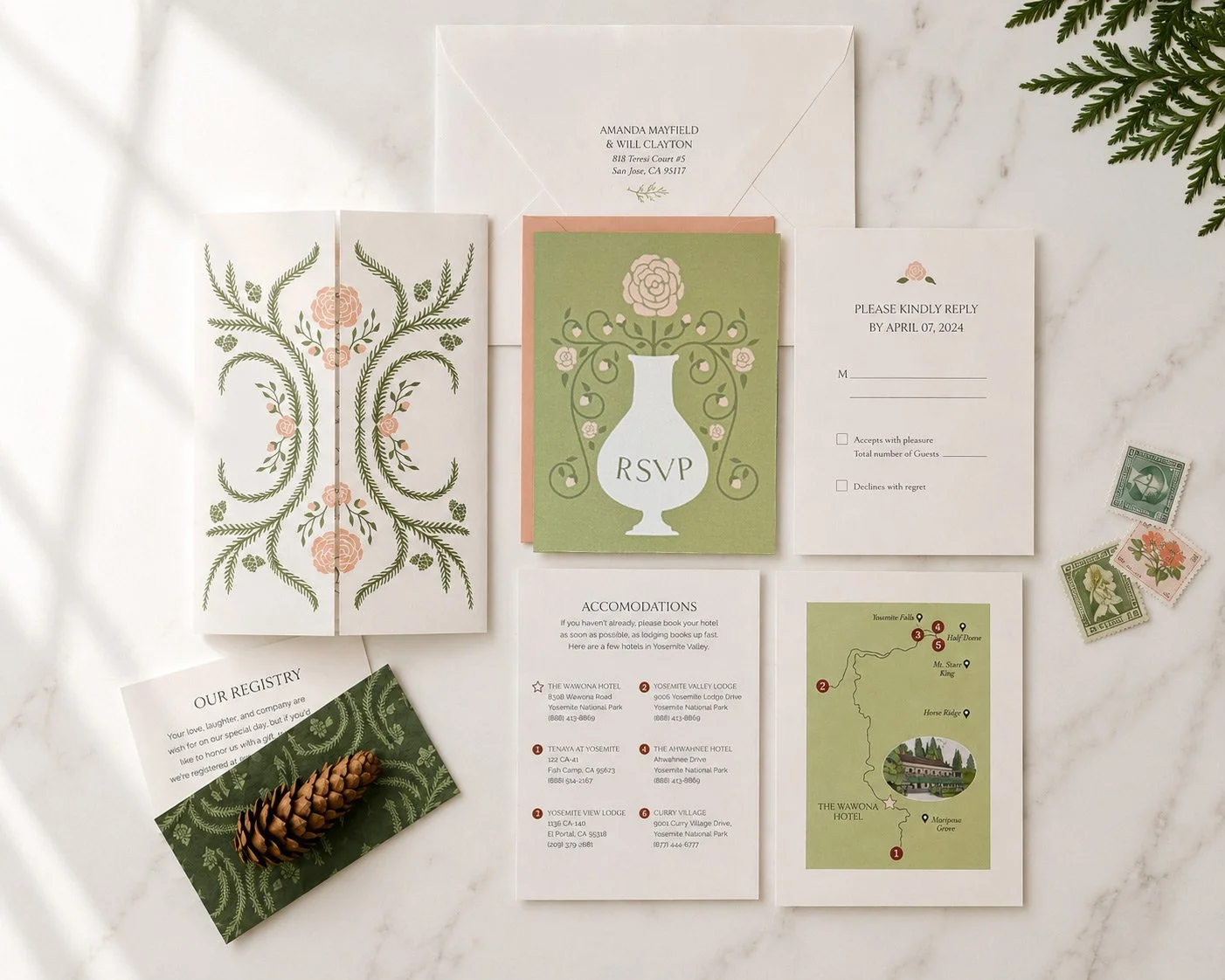 A custom wedding invitation suite including a floral vellum wrap, RSVP card, a venue map with hand drawn artwork, and registry information card.