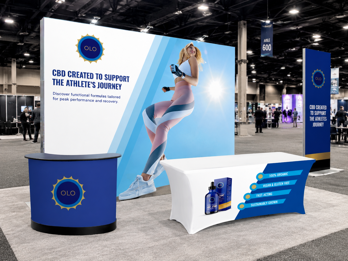 Custom trade show booth design for OLO CBD, featuring a large-format fabric backdrop, branded table cover, and branded counter display — a fully cohesive branded environment designed for activations and trade shows.