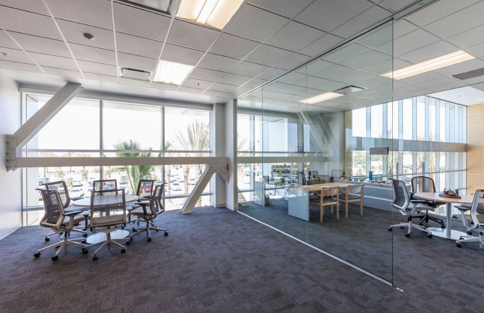 Dealership interior with tables and chairs