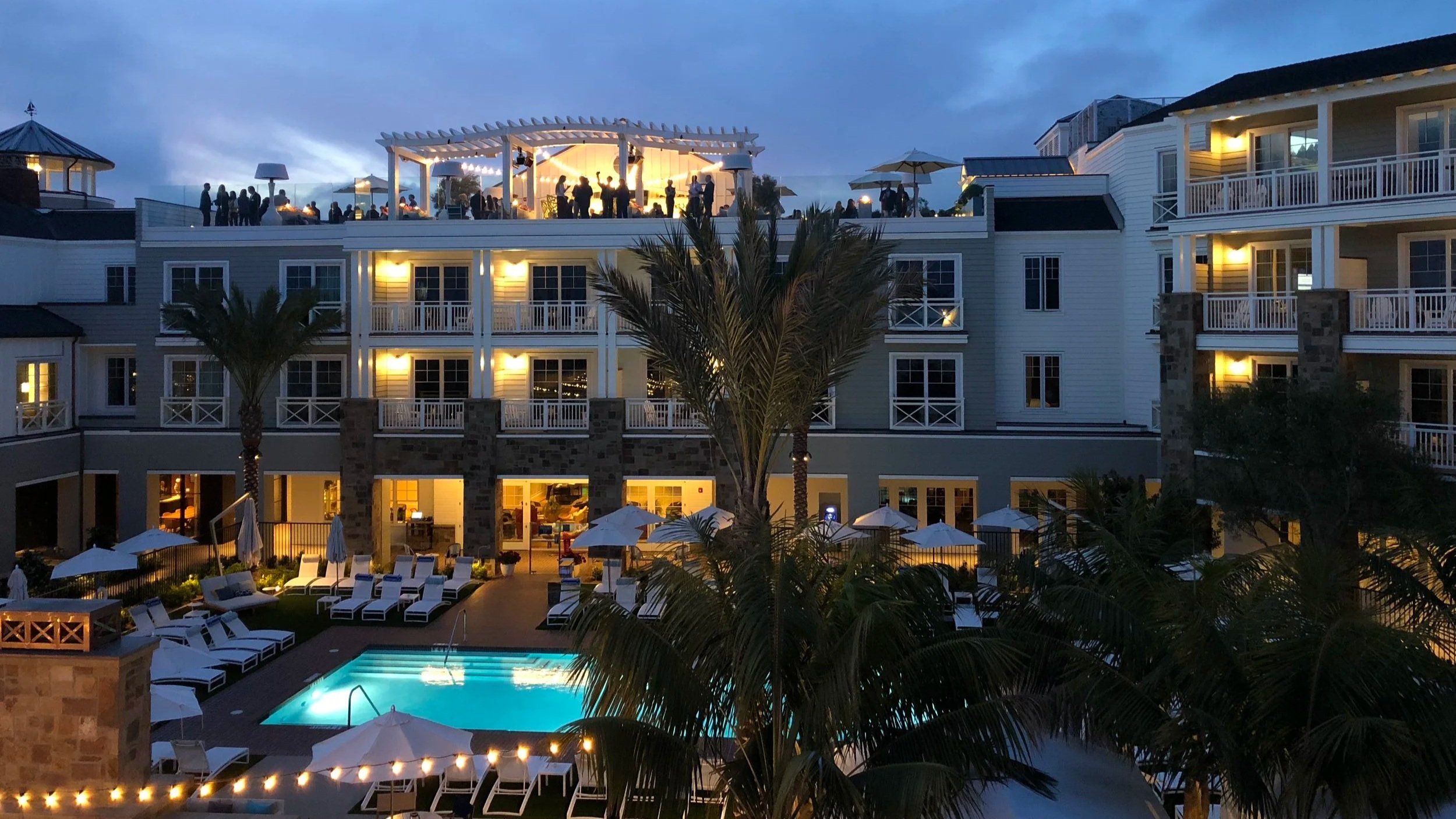 Lido House exterior and pool at night
