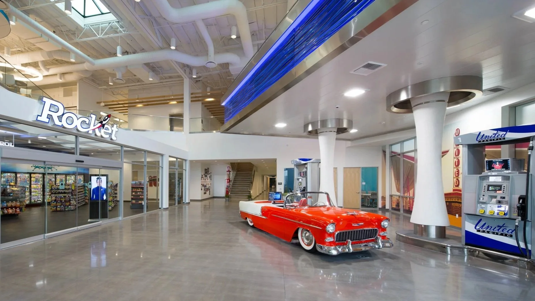 building lobby with vintage red car
