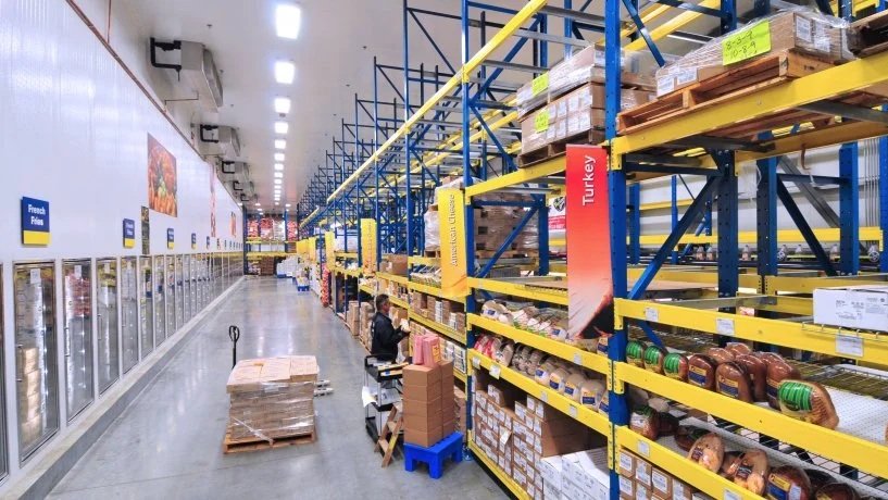 stocked warehouse shelves and freezers