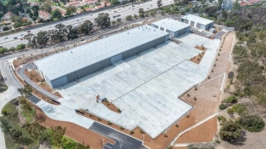 aerial shot of a commercial and industrial development by the freewa