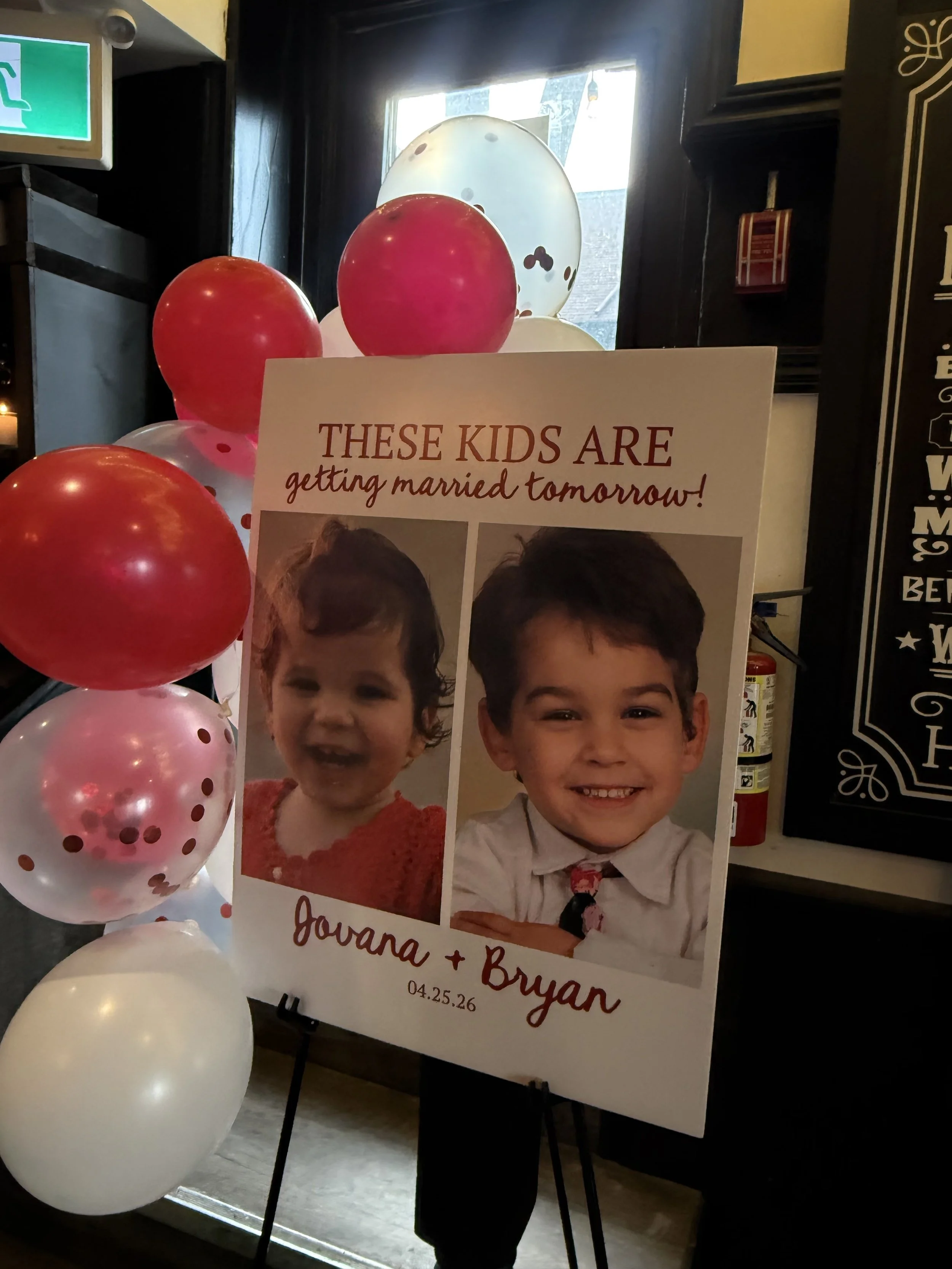 A wedding announcement poster with photos of a happy young boy and girl, decorated with red, pink, and white balloons, and an inside shot of a venue with a window in the background.