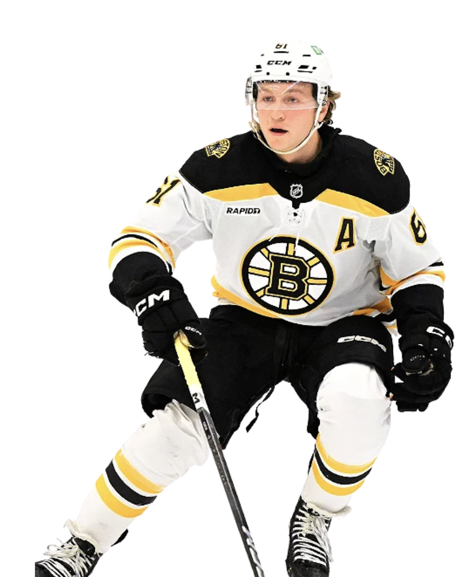 Ice hockey player from the Boston Bruins wearing a white jersey with black and yellow accents, holding a hockey stick, wearing a helmet and gloves, on a white background.